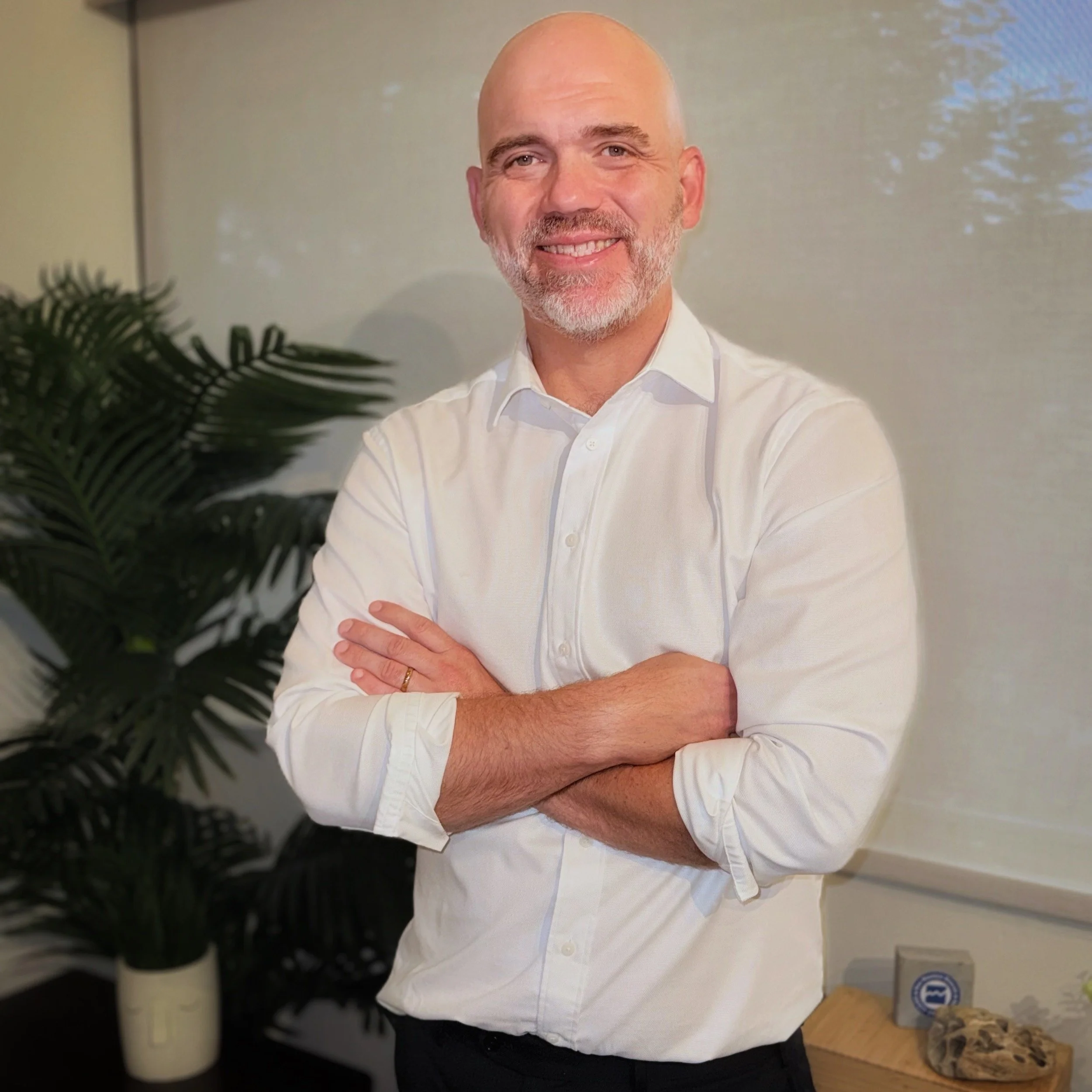 Ben Esch, LMFT, smiling in his San Marino, CA therapy office.