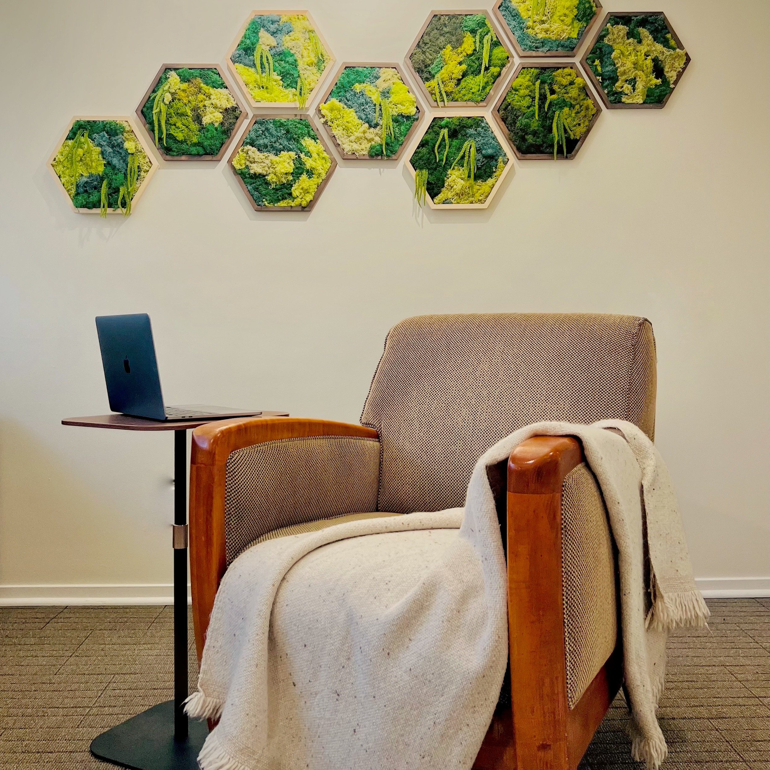 A view of Ben Esch, LMFT's chair, and moss art in his San Marino, CA therapy office.