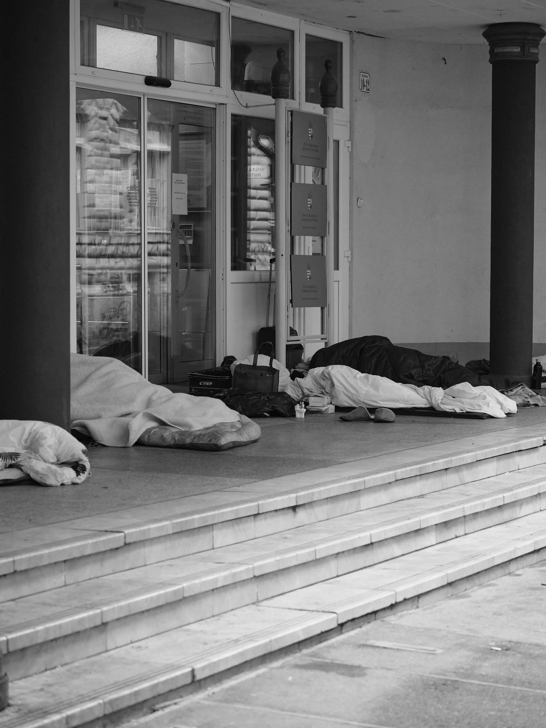 Public steps become bedrooms when there’s nowhere else to go.