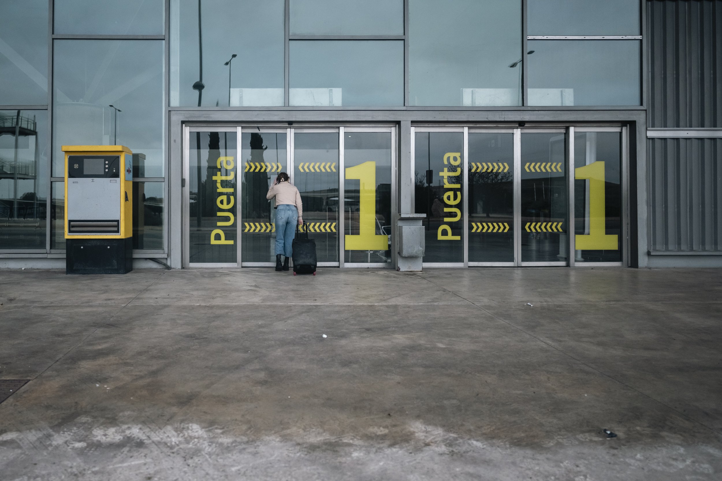 The plan of egres: a lone traveler waits for doors that will never open..