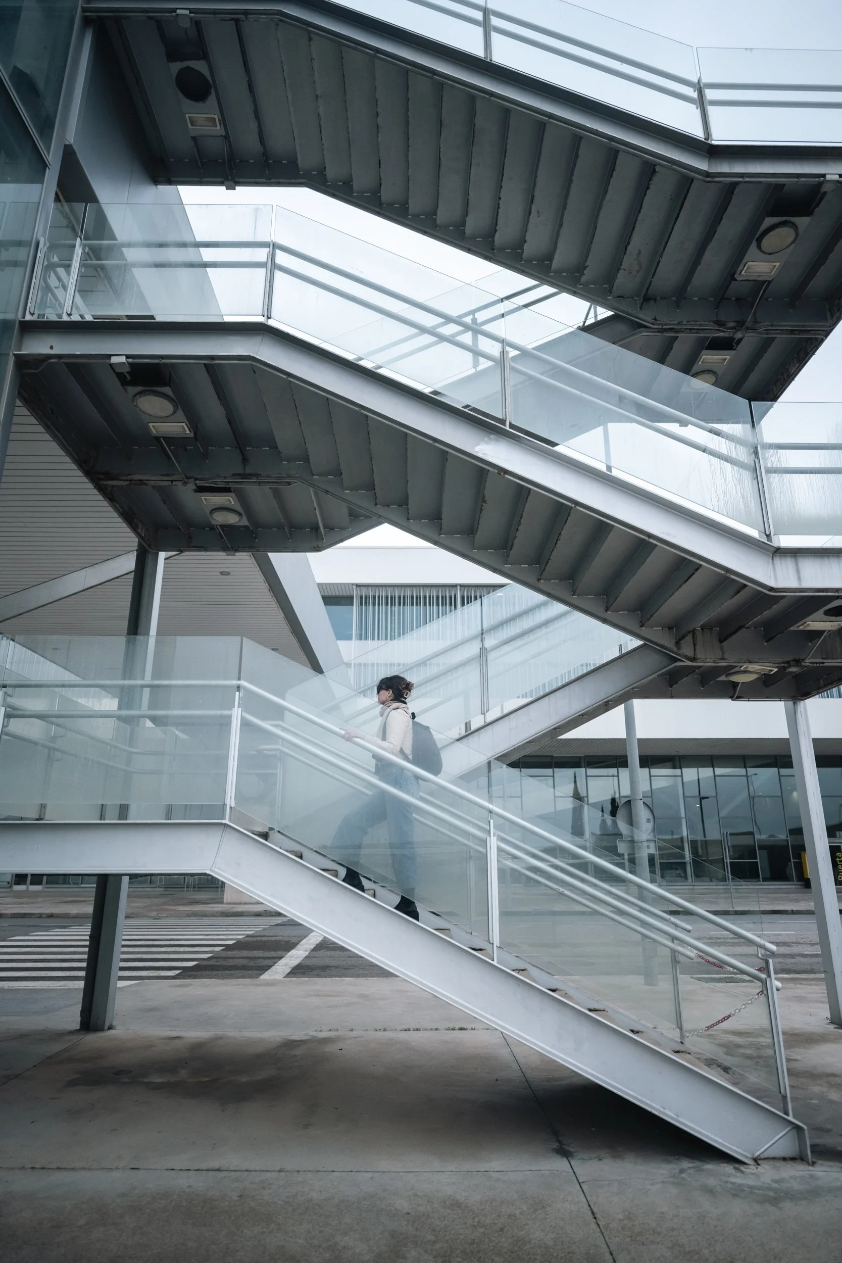 A lone traveler climbing toward the light, and where the halls are dark.