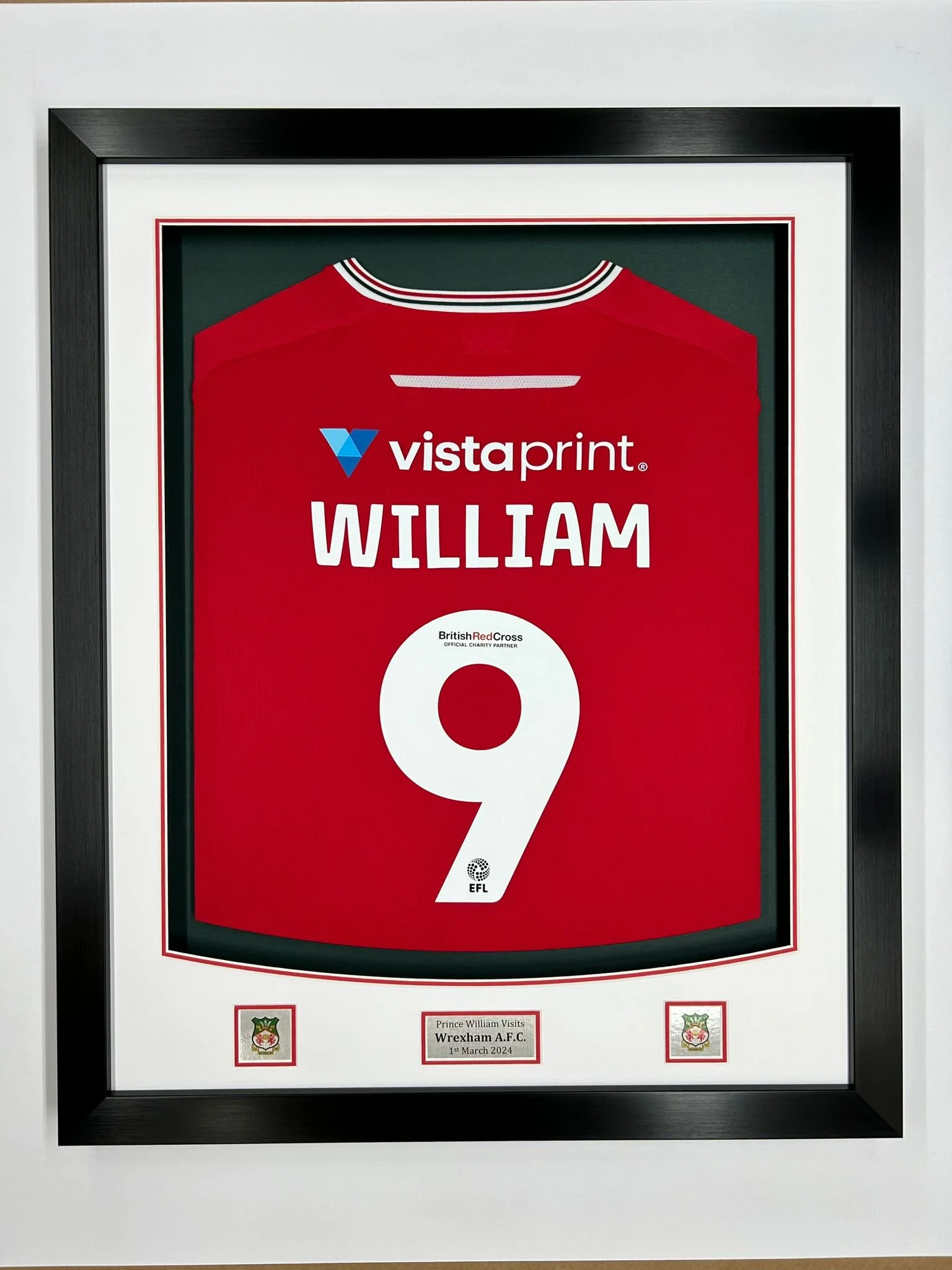 Framed football jersey of WILLIAM with the number 9, associated with Wrexham A.F.C., commemorating a visit by Prince William on March 1, 2024, with British Red Cross logo.