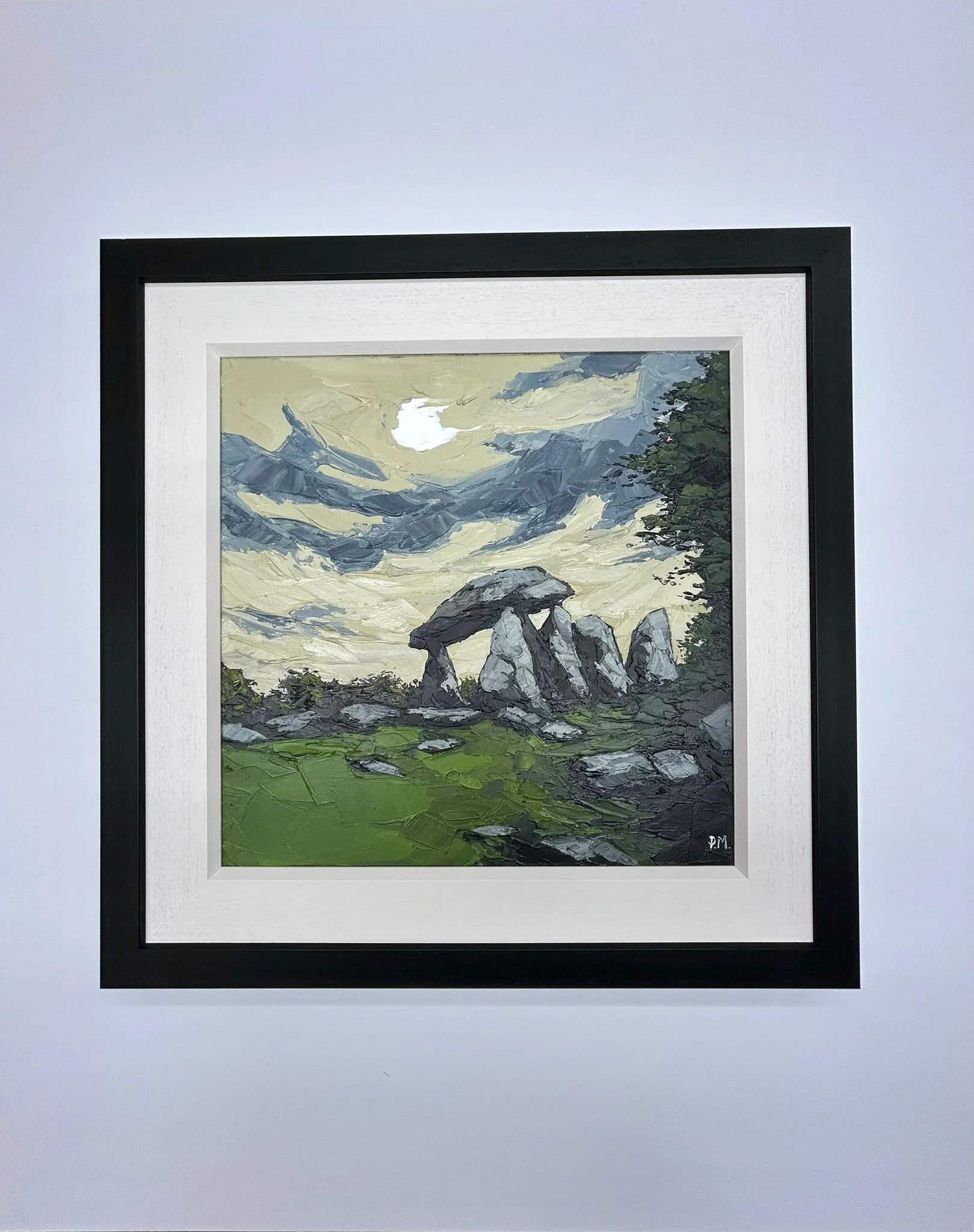 Painting of stone formations in a landscape with a cloudy sky and green grass in the foreground.