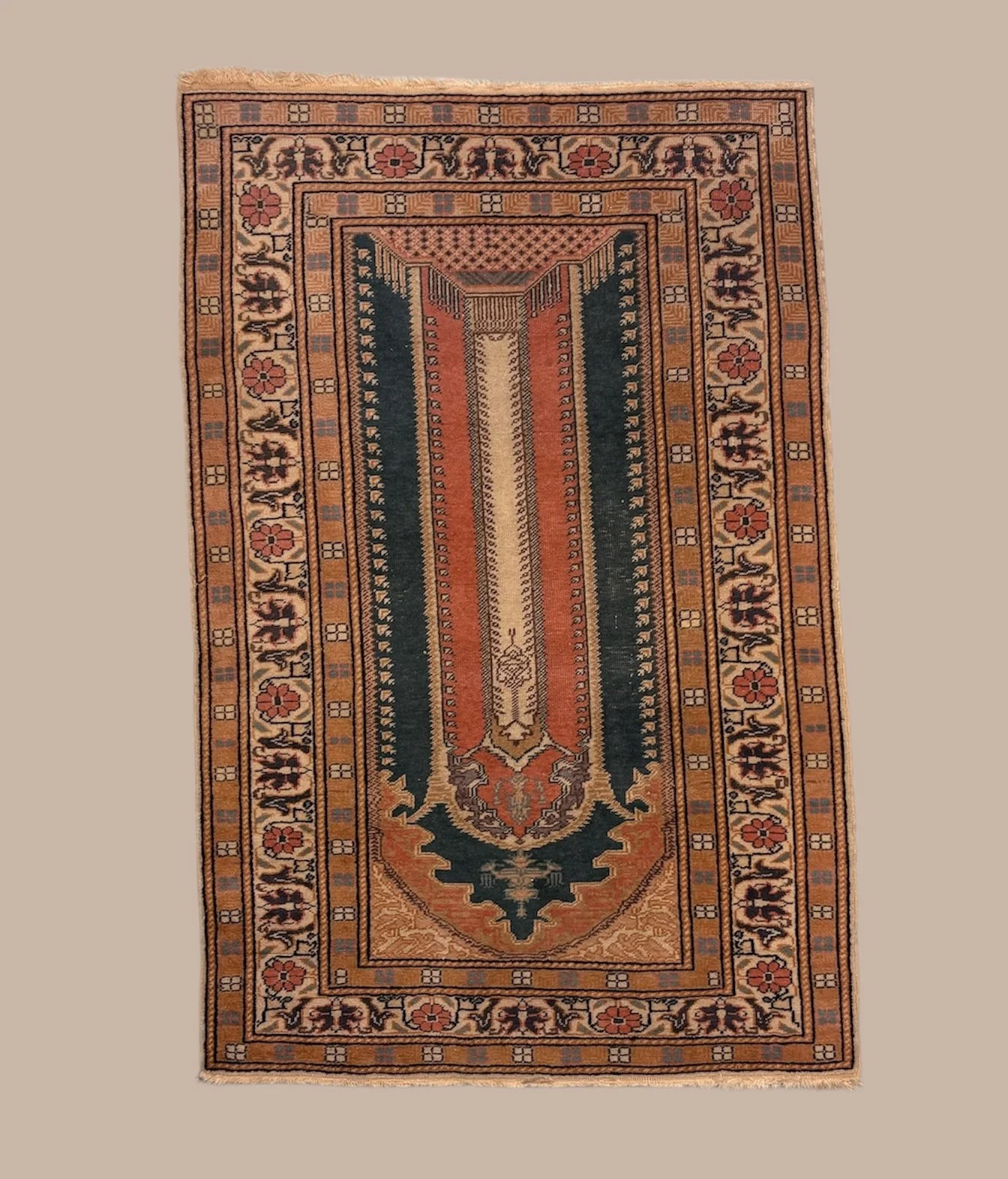 A colorful traditional area rug with geometric patterns and floral motifs in shades of orange, green, beige, and black.