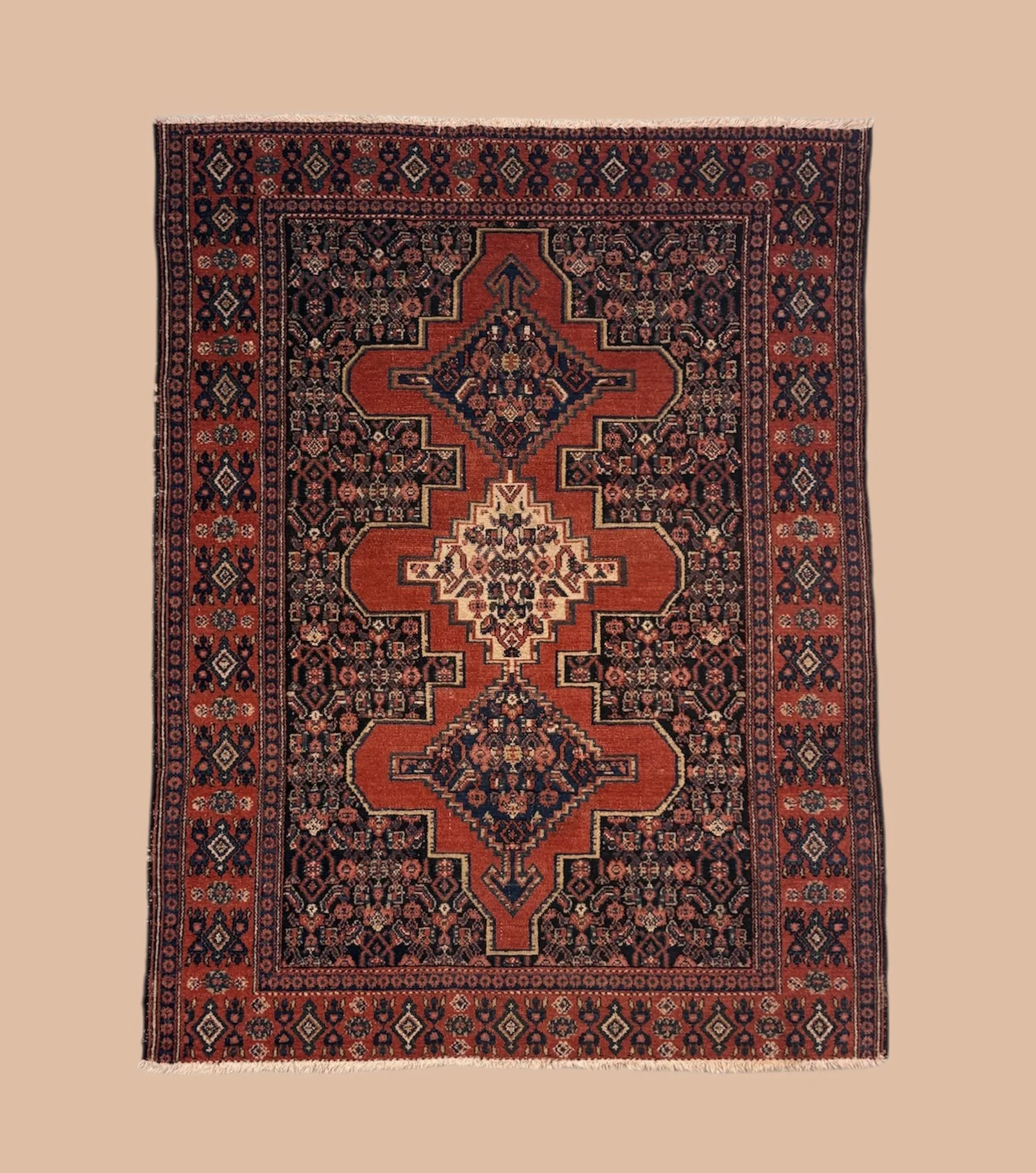 A traditional Persian-style Rug with geometric patterns in red, black, beige, and dark blue colors.