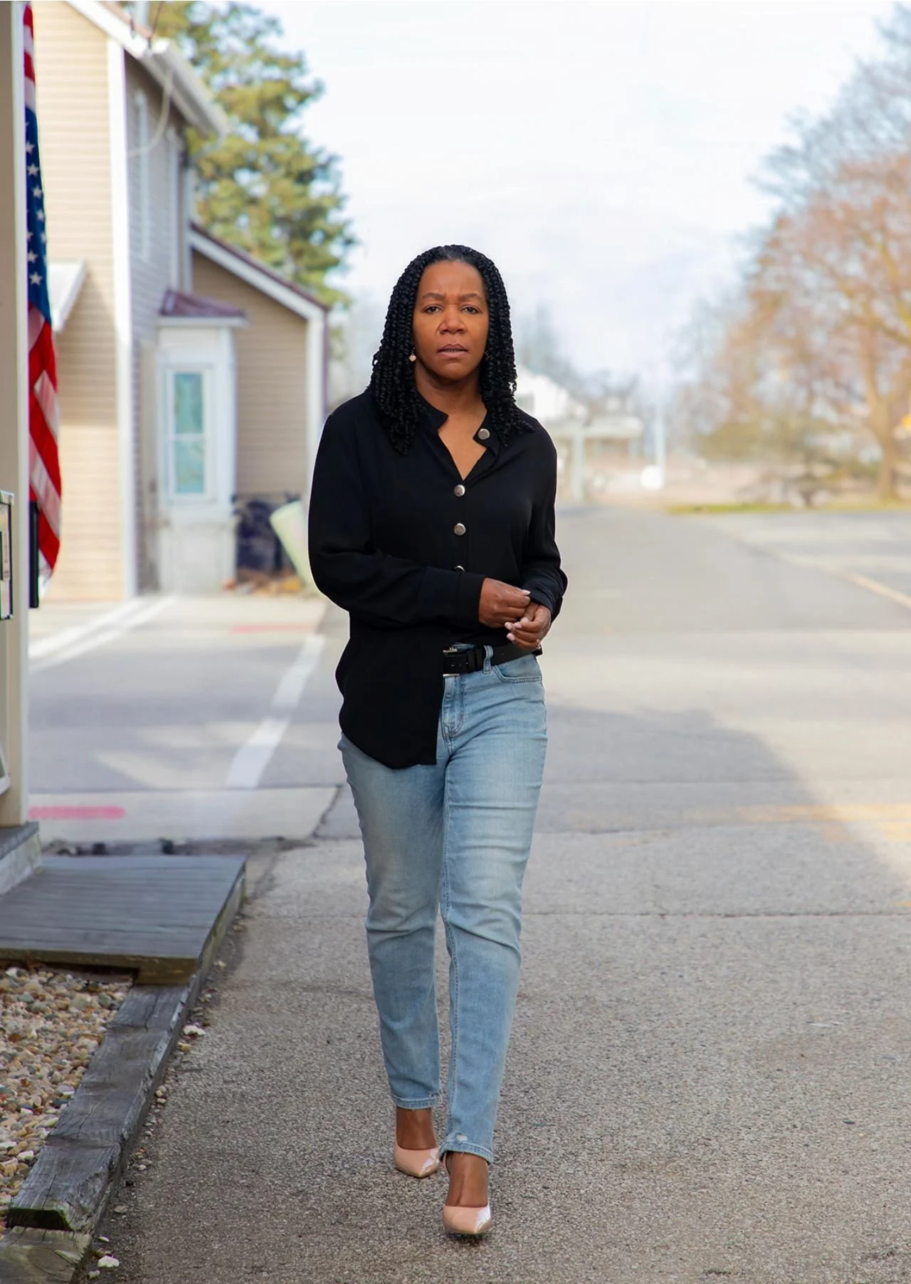 Pastor Larissa Moore-Willard, walking on street.