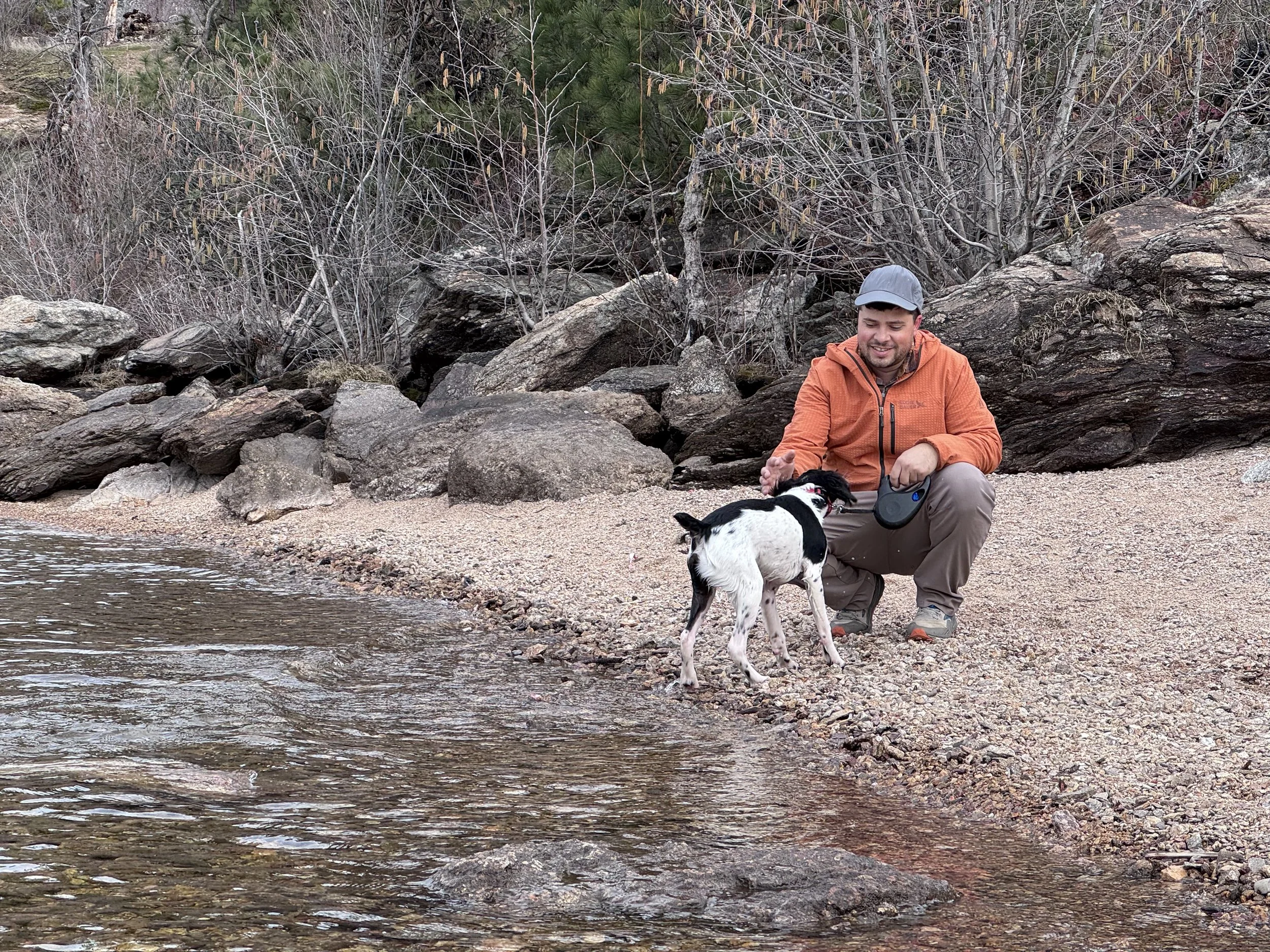 Tyler Zehr, PA-C outdoors in North Idaho with his dog