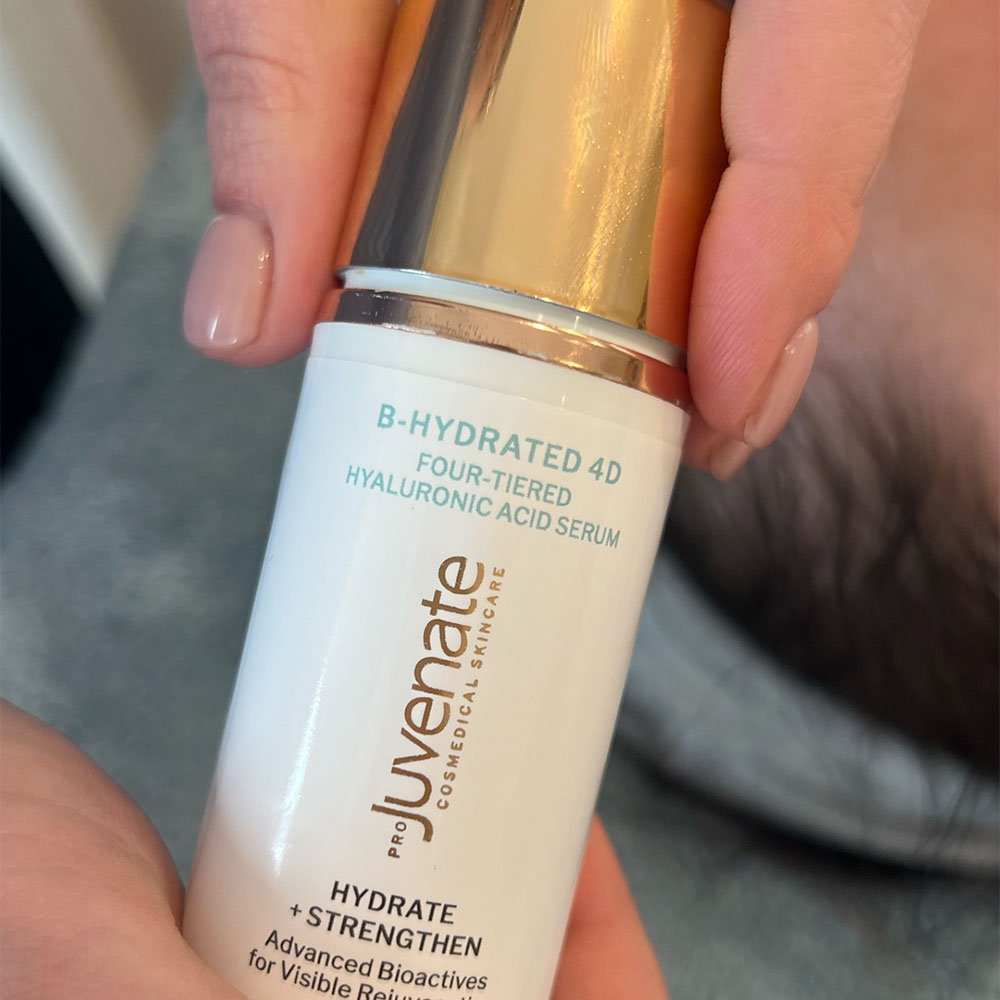 close up hands holding Juvenate B-Hydrated 4D