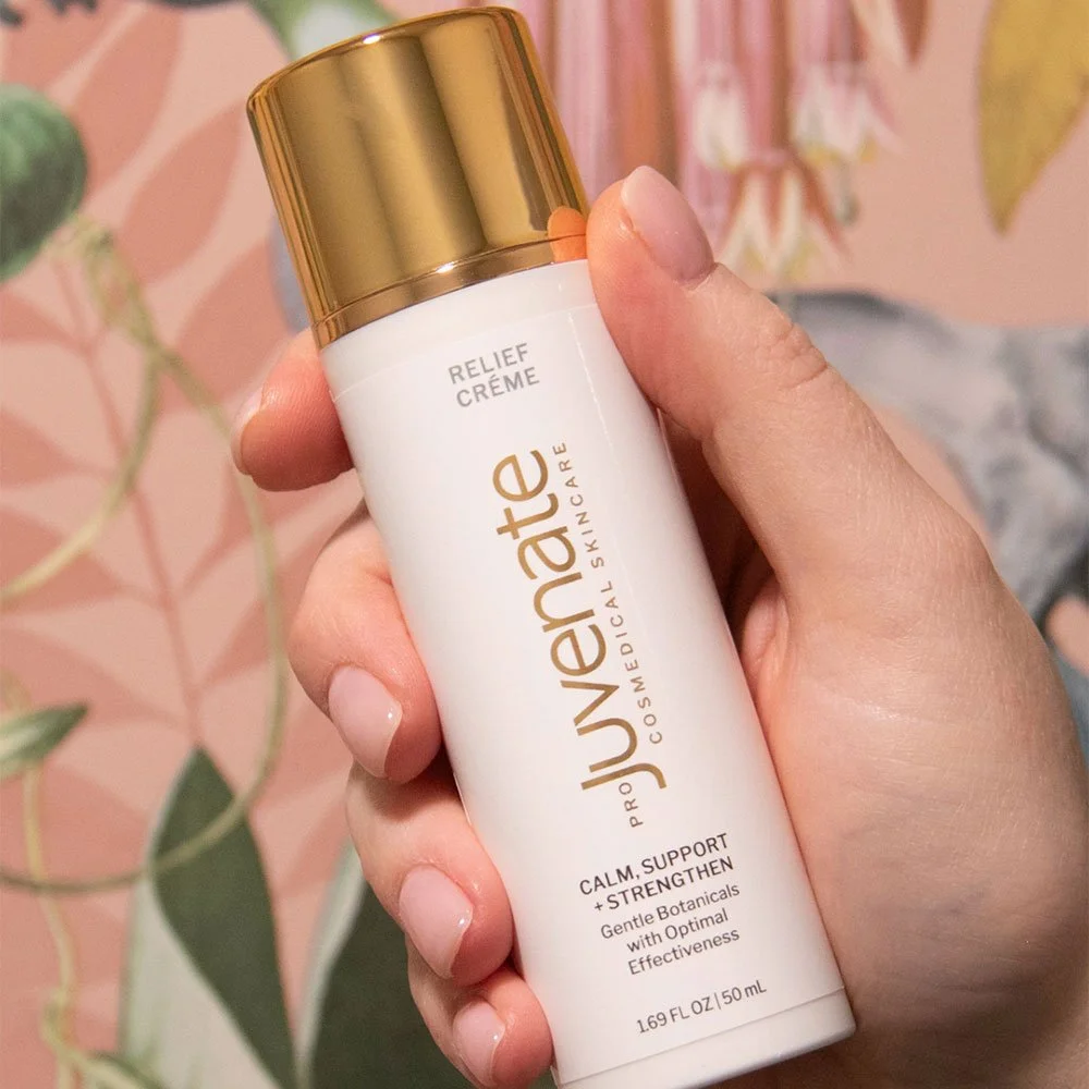 hand holding Juvenate Relief Crème