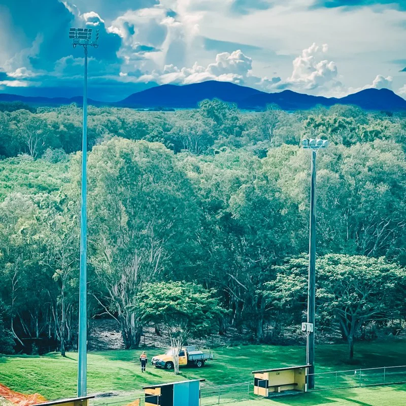 from the distance of the flood lights and yellow car 