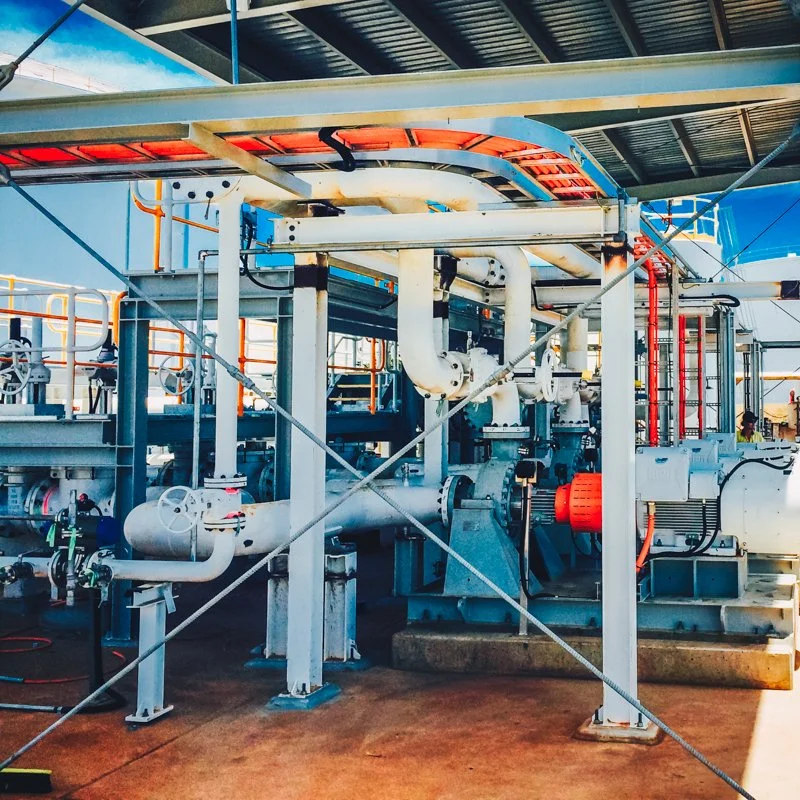 conduit leading into a machine and electrical wires above it
