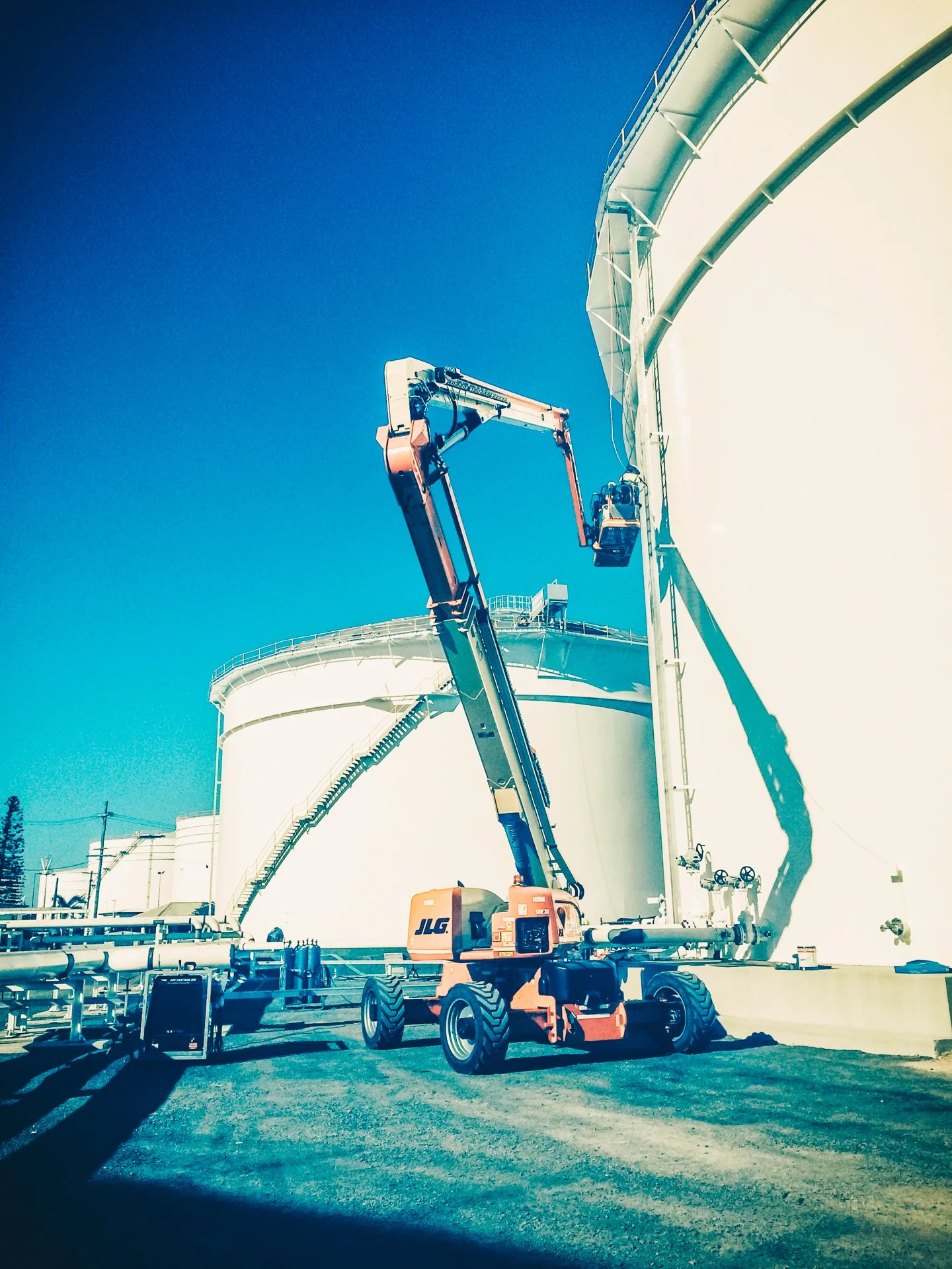 massive machinery working on big tanks near the Mackay Harbour