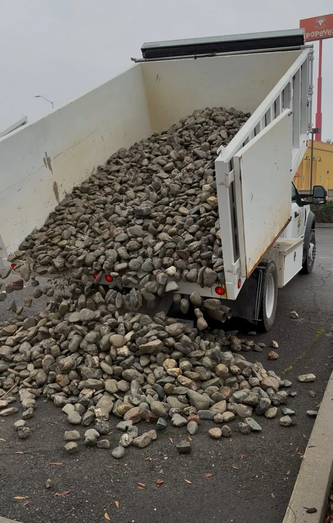 White utility dump truck used for material hauling by Wild Toad Landscape Materials serving Anderson, Redding, Cottonwood, and nearby Northern California communities.