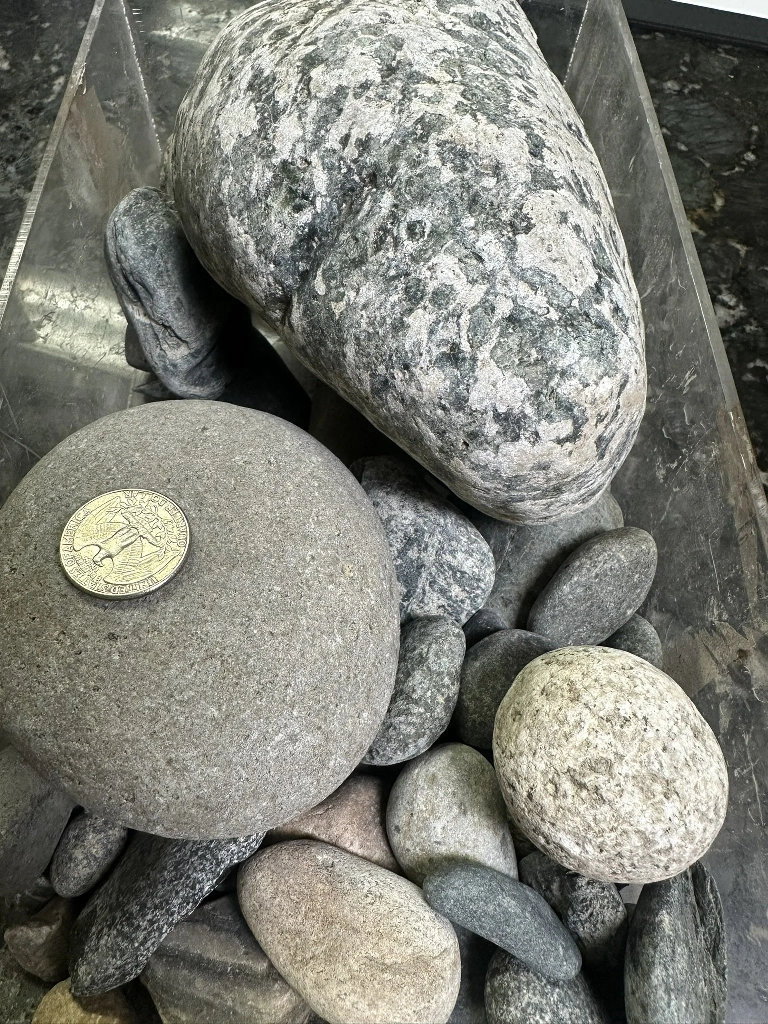 Cascade 2 to 5 inch natural rounded cobble with blue-gray tones, white mineral accents and smooth surfaces, available at Wild Toad Landscape Materials in Anderson, CA.