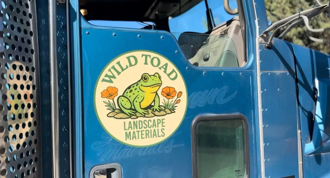 Flatbed delivery truck with piggyback forklift delivering construction materials from Wild Toad Landscape Materials in Anderson, CA to Anderson and Redding.