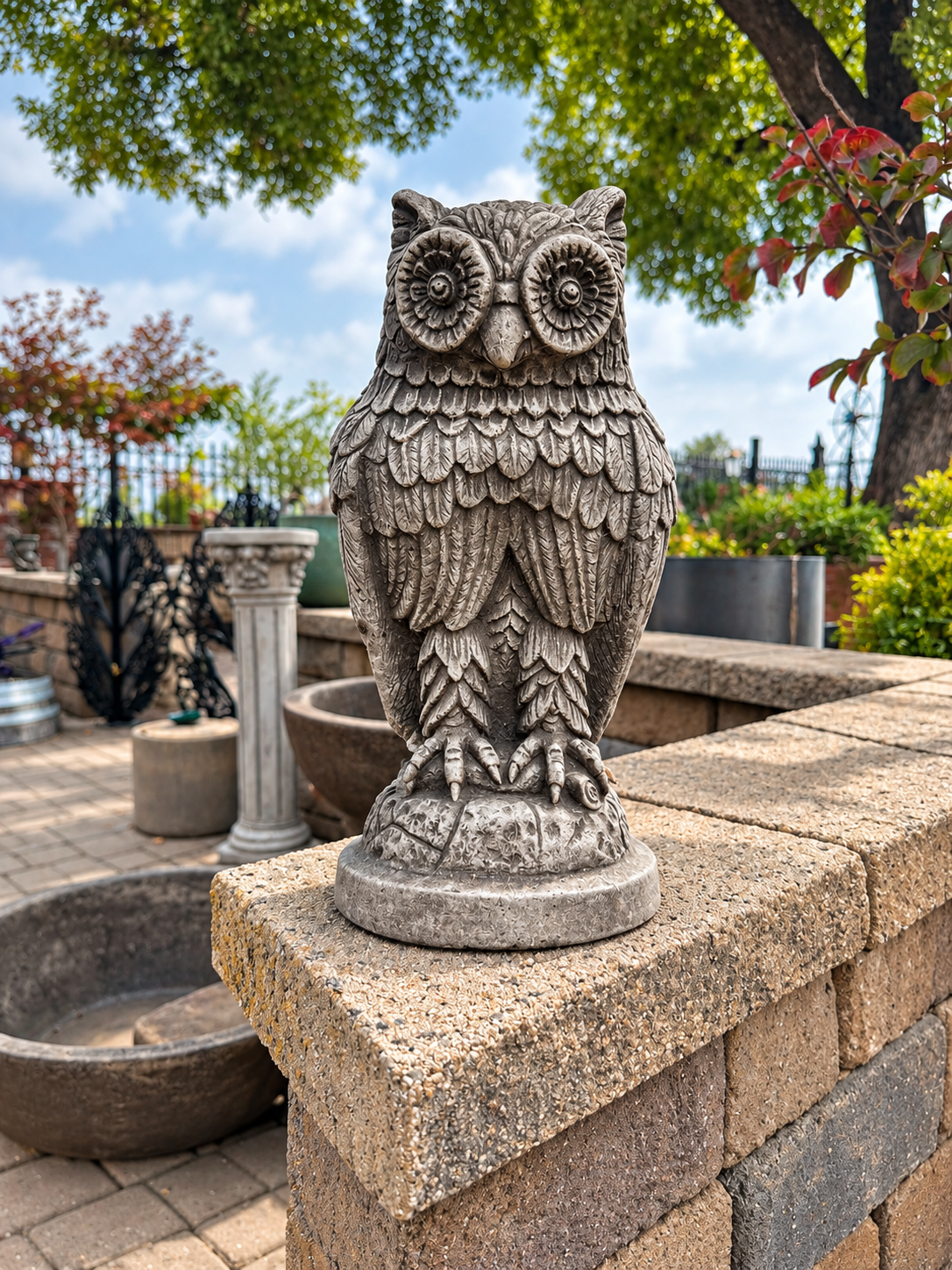 A stone sculpture of an owl for sale