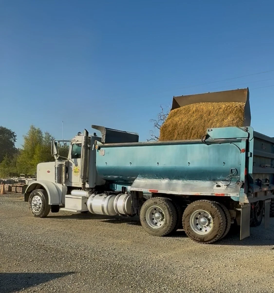 Bulk material delivery truck from Wild Toad Landscape Materials providing service to Anderson, Redding, Cottonwood, and surrounding communities.