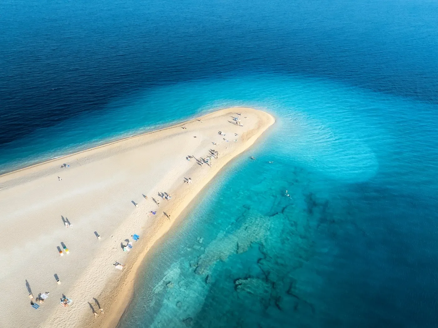 aerial-view-of-blue-sea-sandbank-white-sandy-bea-2024-12-05-19-03-57-utc.webp