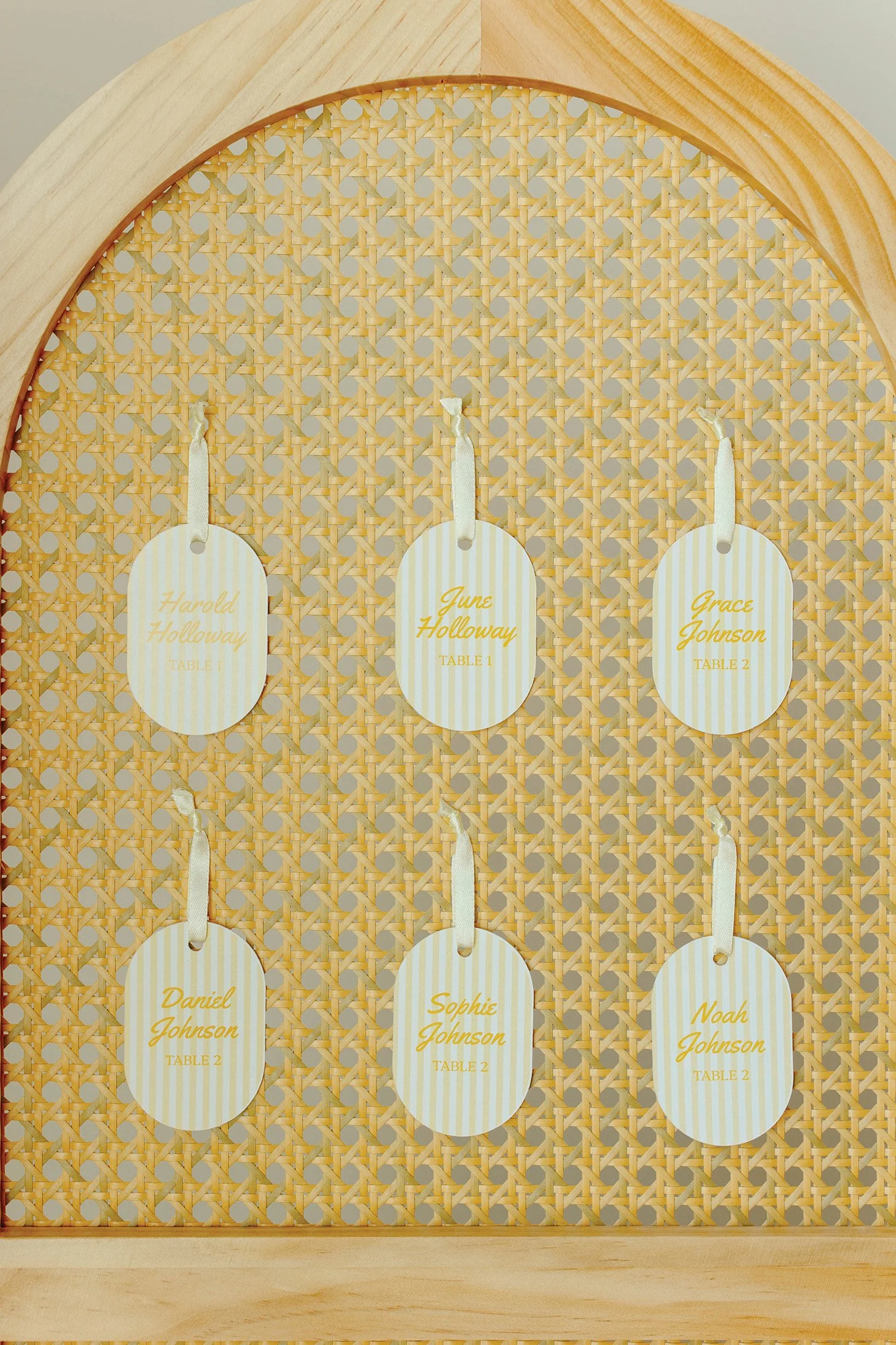 Rattan room divider screen with name assignment tags attached