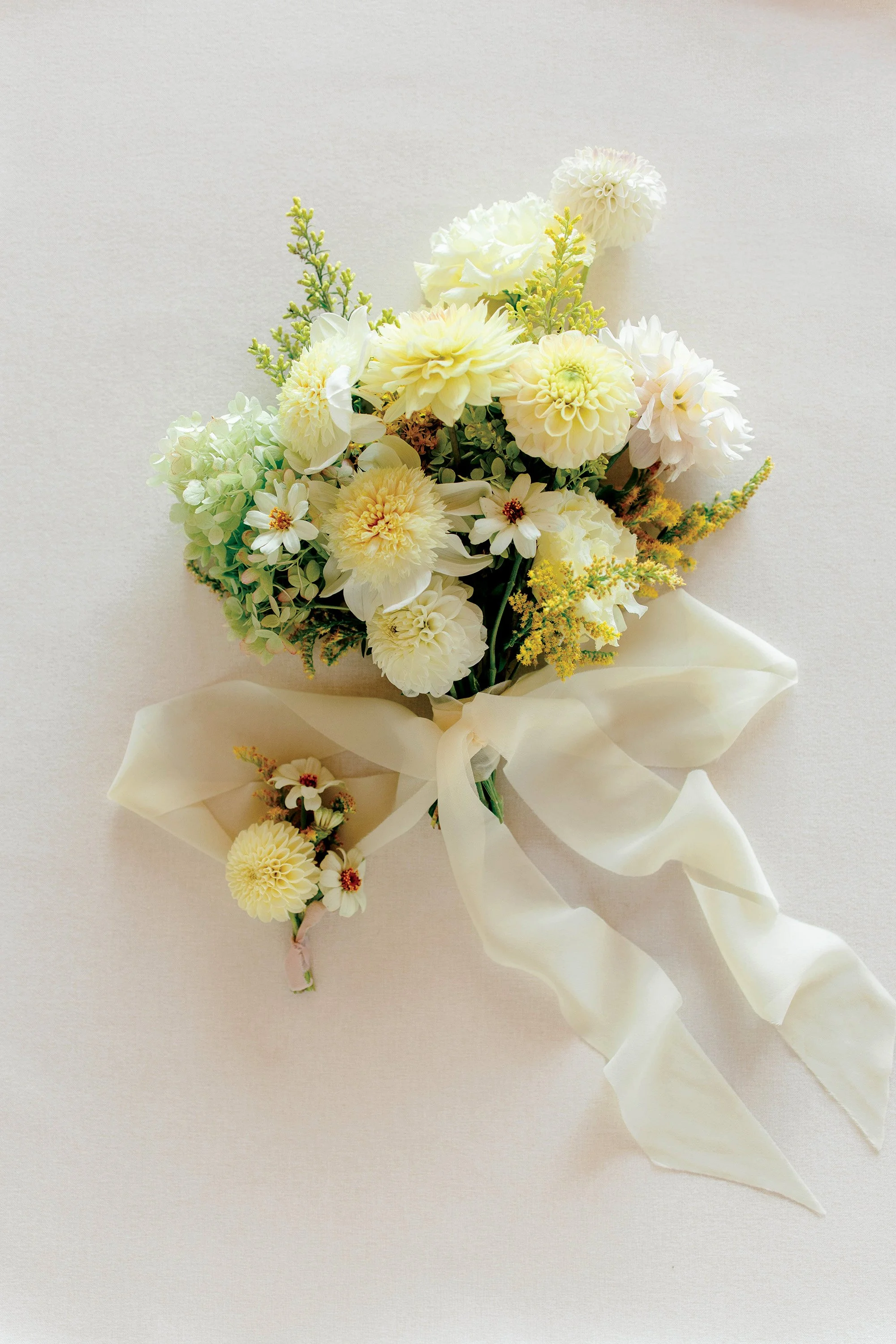 Yellow flower bouquet with white ribbon 