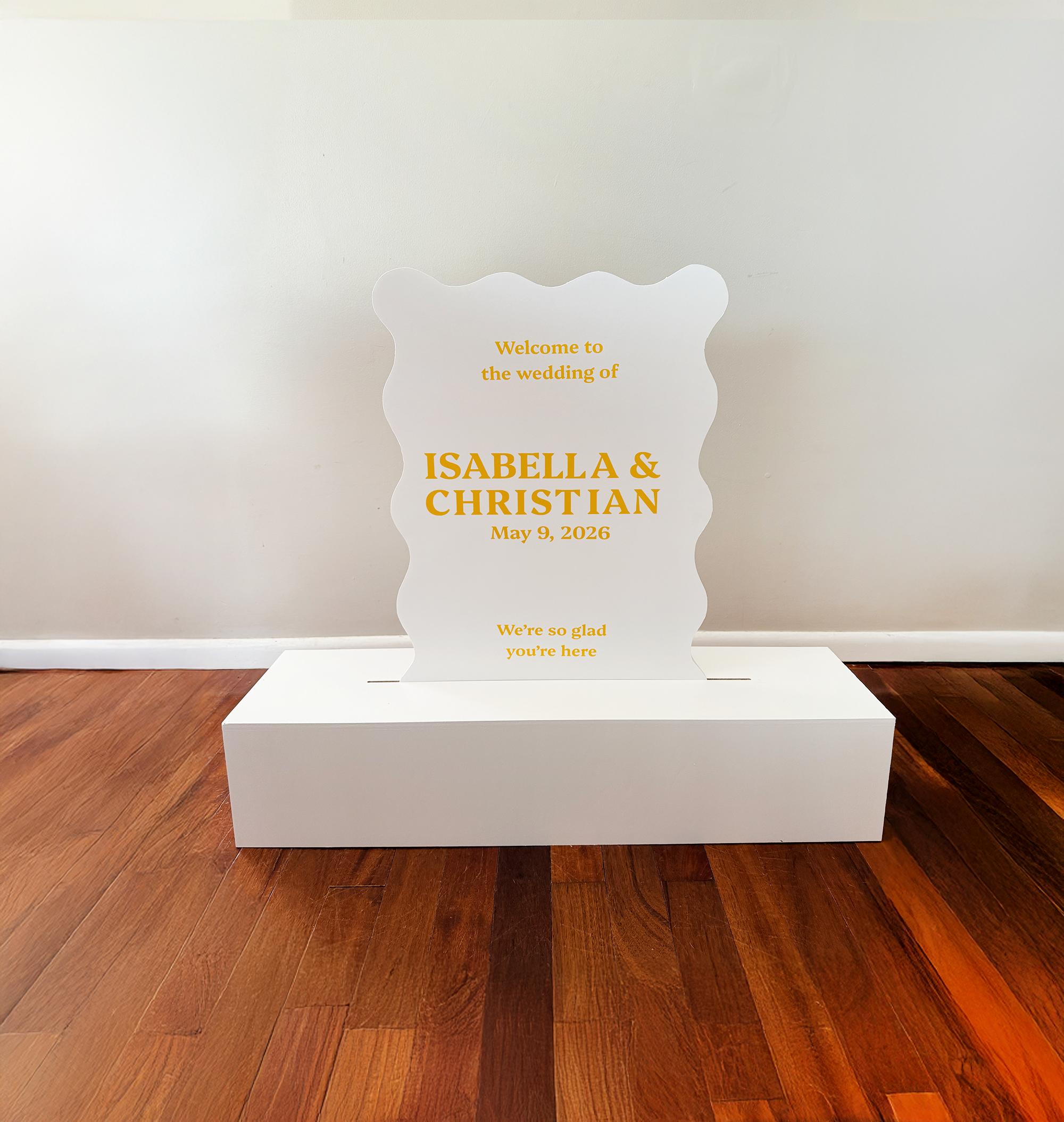 White wavy edge sign in a white rectangular base