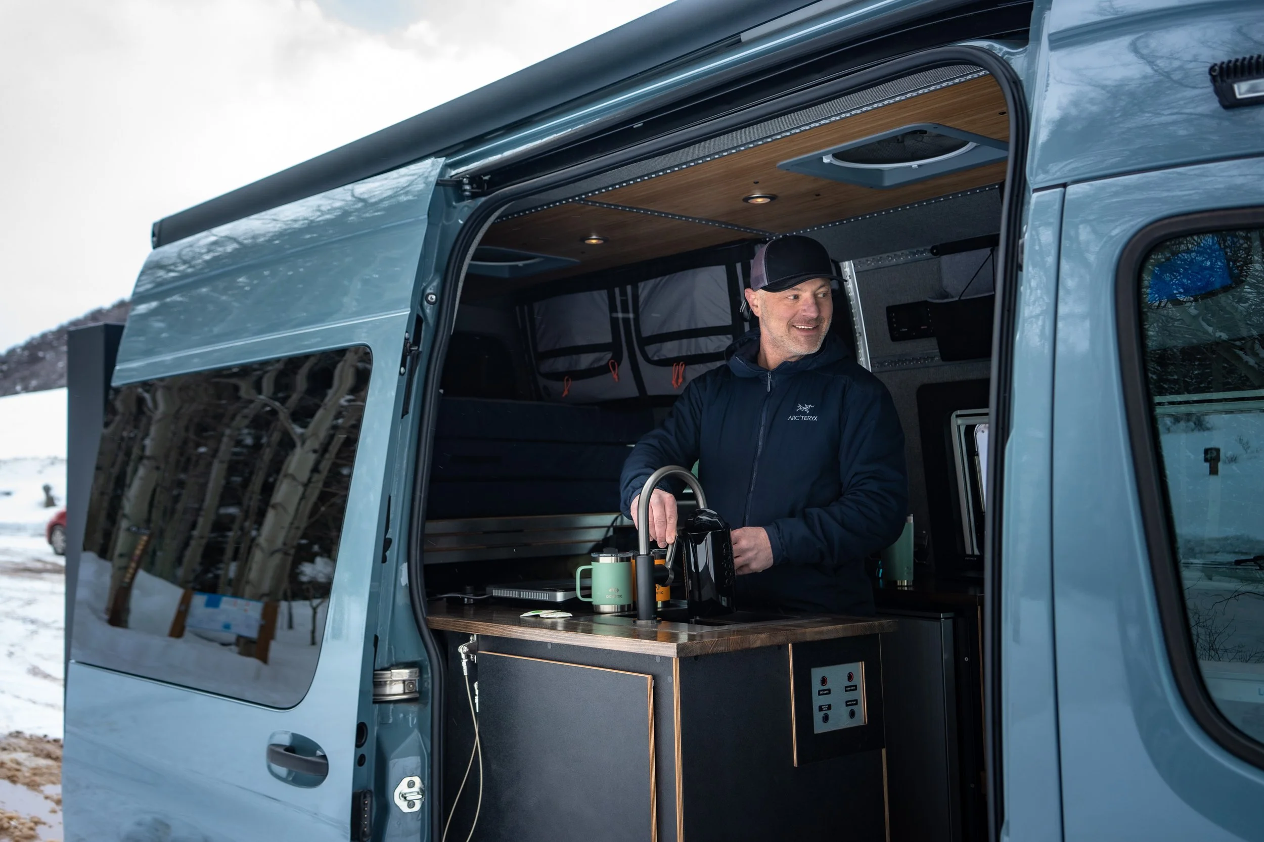 Making coffee in an off-grid Sprinter Van in Aspen, CO