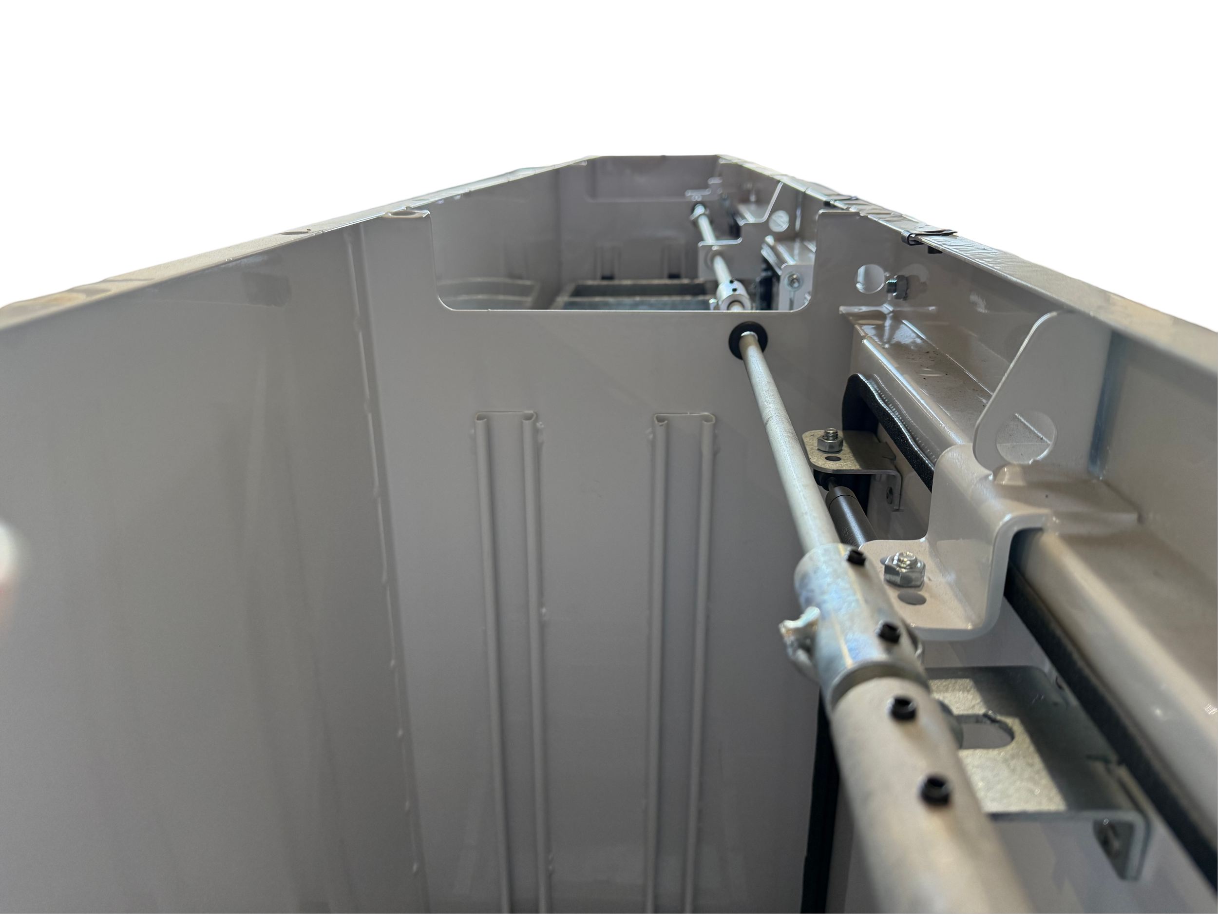 Close-up of a metallic mechanical or industrial machinery component with metal rods, bolts, and structural parts.