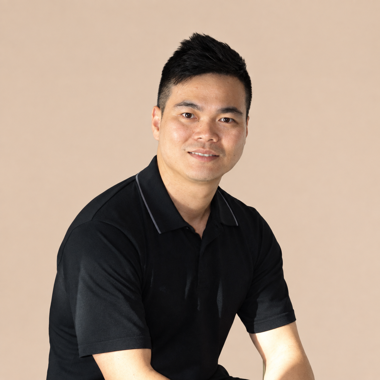Close-up of Minh Le, a male remedial massage therapist with recognised qualifications, specialising in sports massage and elderly massage therapy.