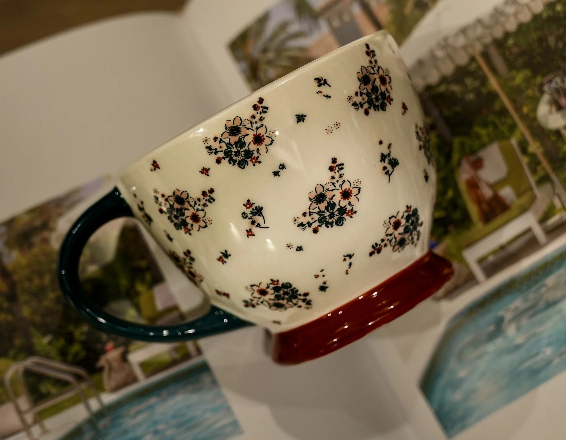 Floral teacup-style mug with green handle and red base from Kandles2u-Kandles2Mug Collection-perfect for Austin, Texas Candle Making Workshops/Classes. Date Nights, Girls' Nights, Corporate Events, and Bridal Parties.