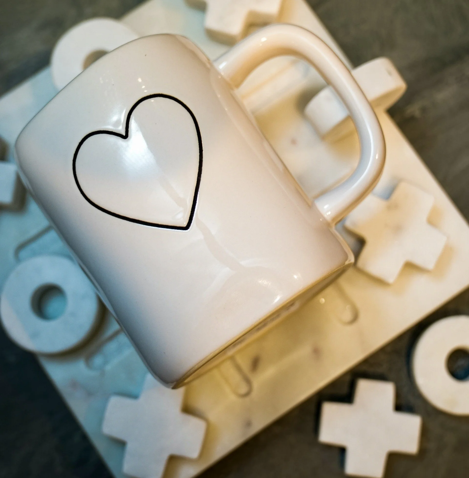 Minimalist white mug with black heart from Kandles2u- Kandles2Mug Collection-perfect for Austin, Texas Candle Making Workshops/Classes. Date Nights, Girls' Nights, Corporate Events, and Bridal Parties. Valentines Day Themed.
