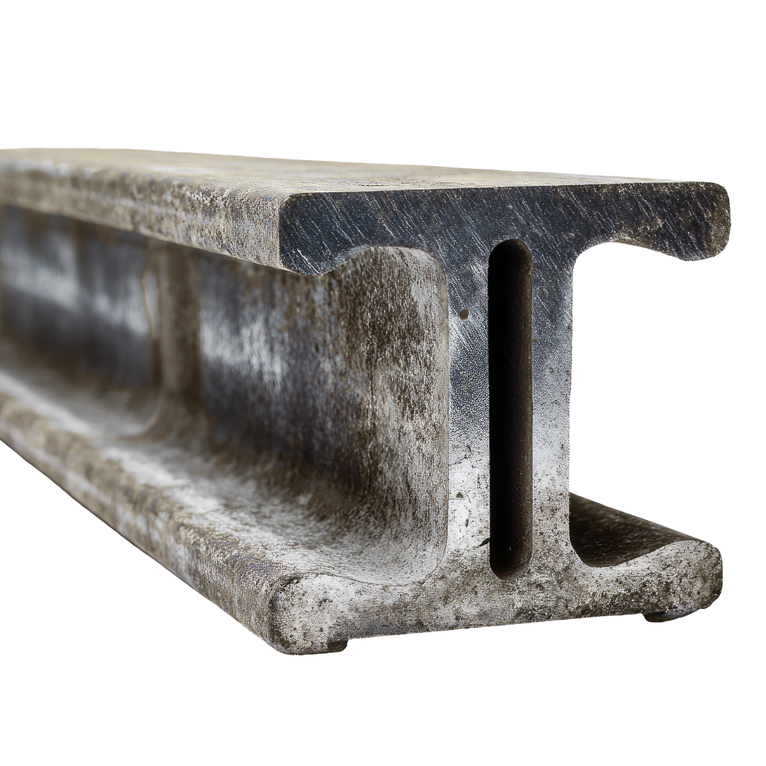 Close-up of a weathered steel I-beam with rust and corrosion.