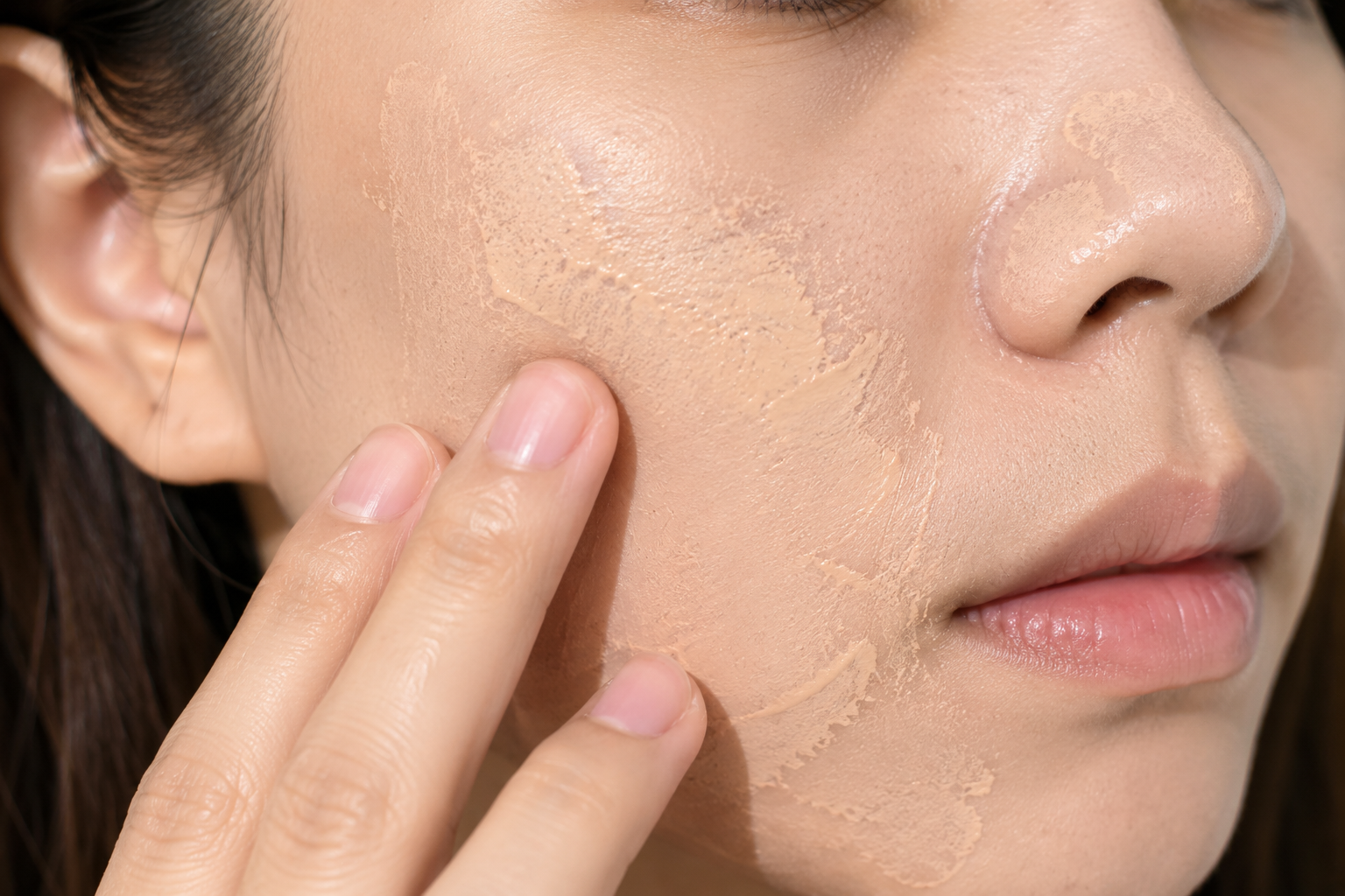 reapplying tinted sunscreen