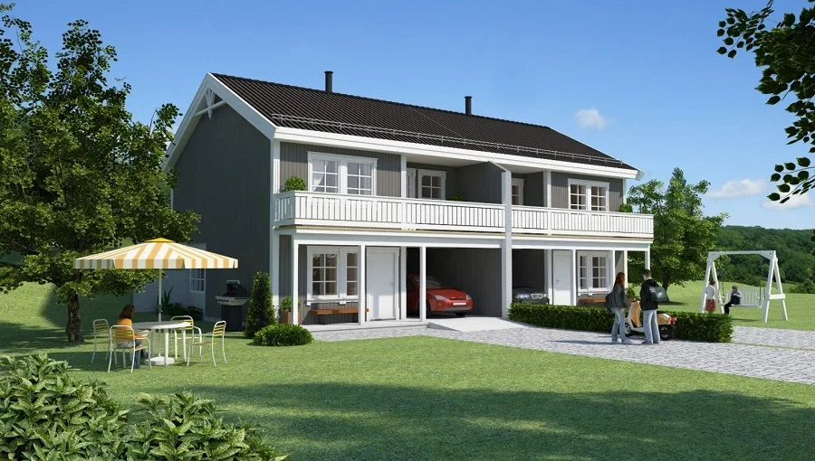 Et toetasjes hus med en liten terrasse og en garasje, omgitt av grøntarealer med trær, en sittegruppe med parasoll, og en barna-lekeplass med en gynge, under en klar blå himmel.