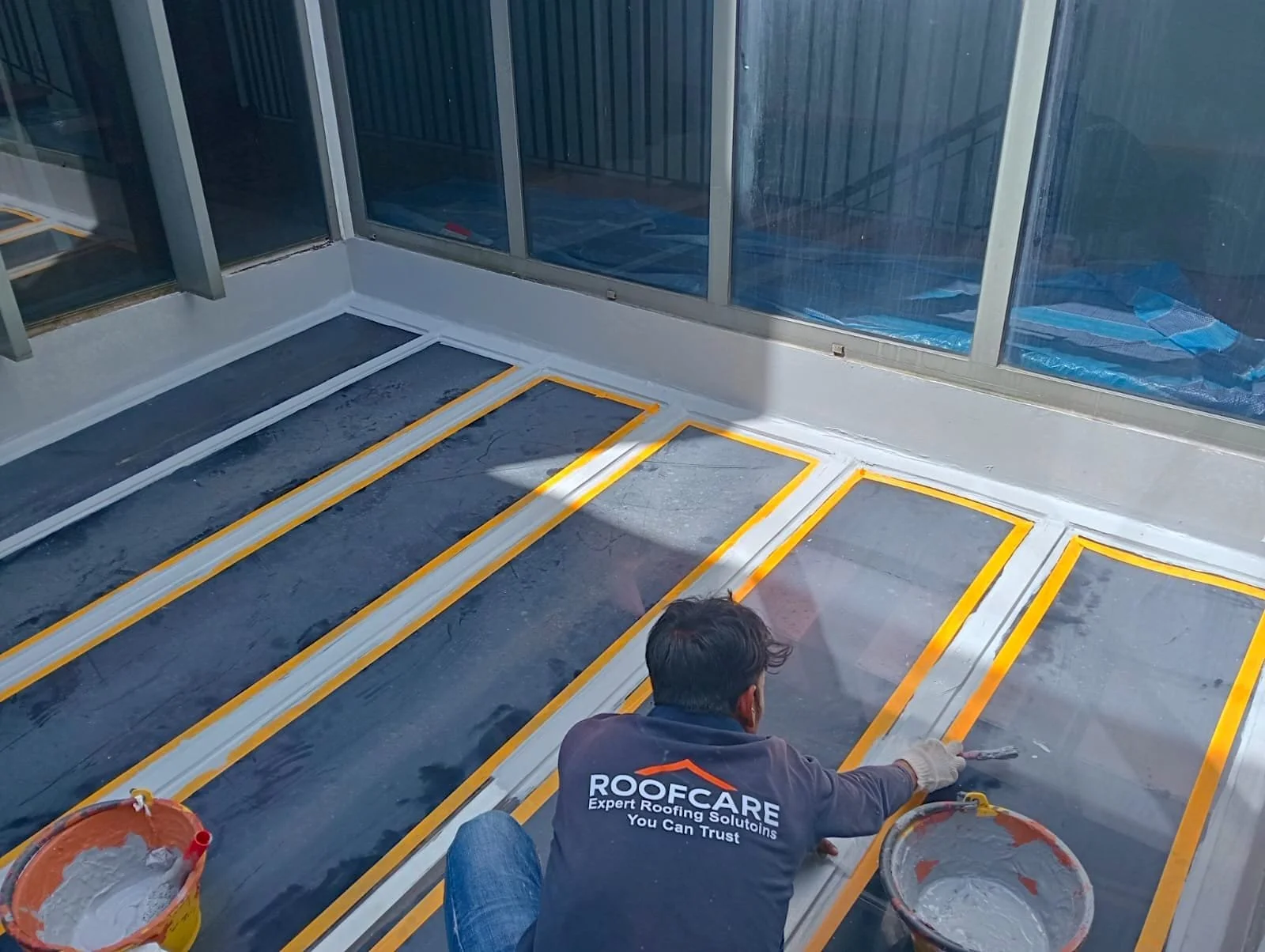 skilled-waterproofing-expert-applying-protective-coating.jpeg
