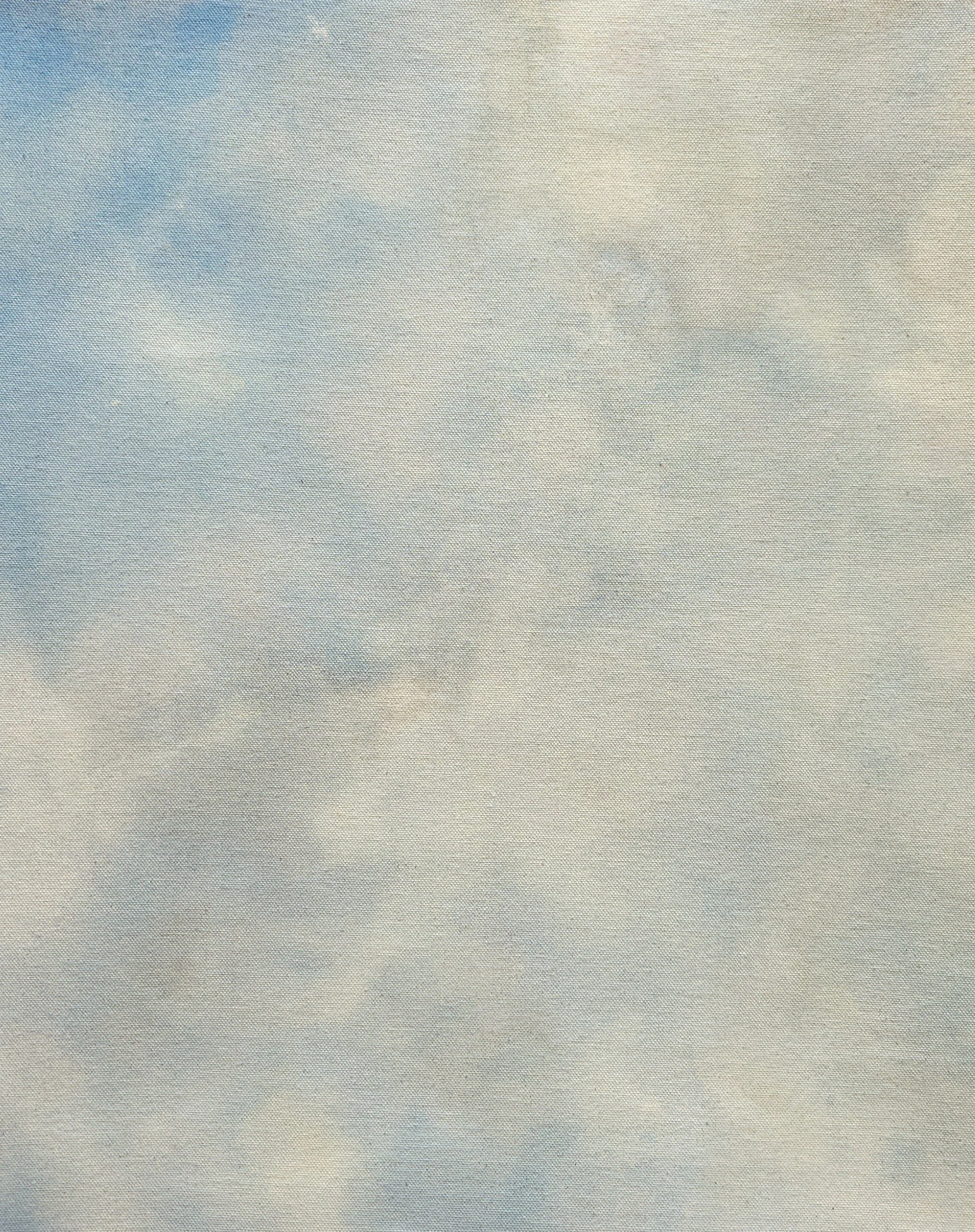 Sky painting with patches of blue coming though the grey clouds.