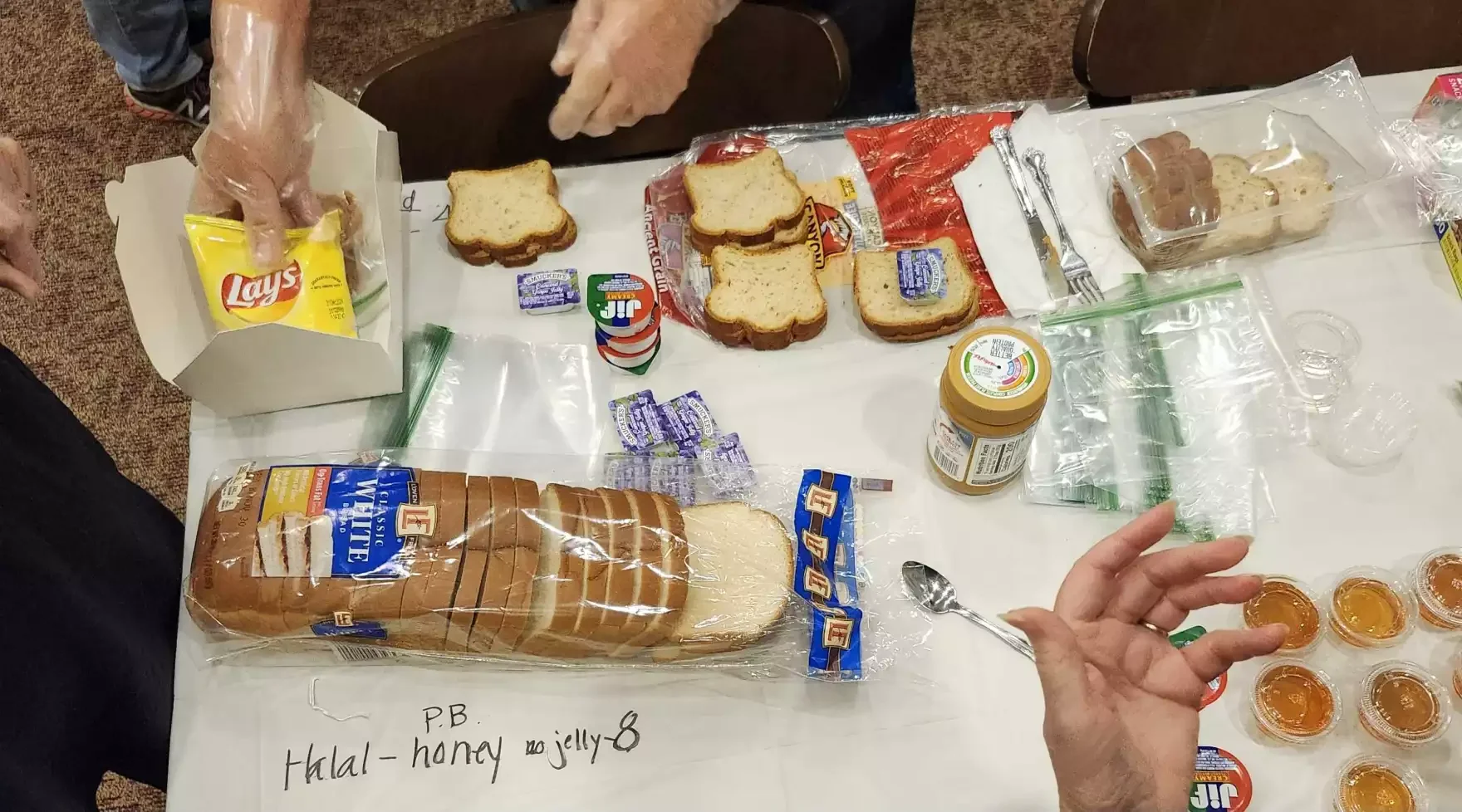 Top view of making peanut butter and jelly sandwiches