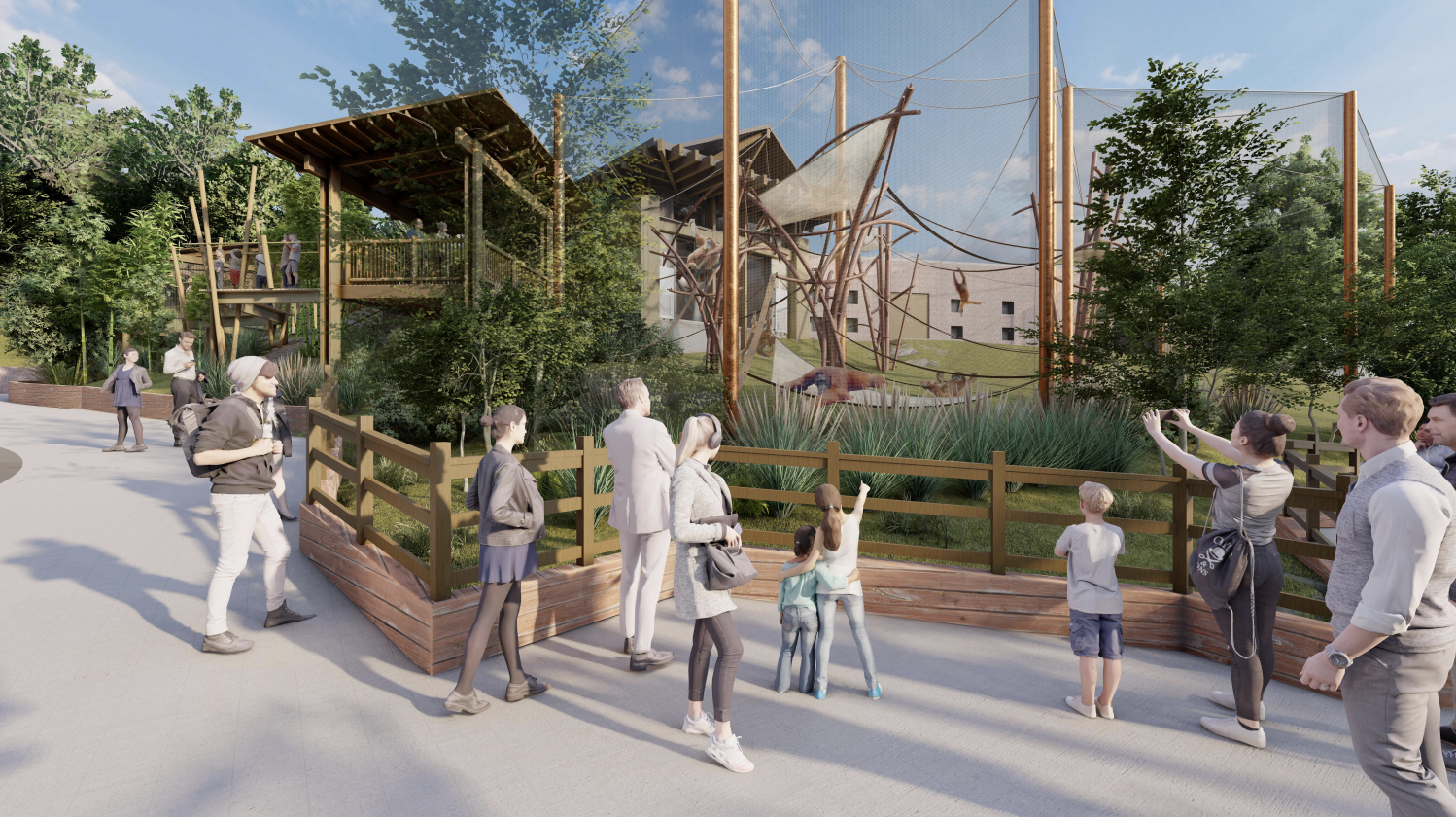 Group of people observing and taking photos of a zoo enclosure with giraffes, trees, and climbing structures.