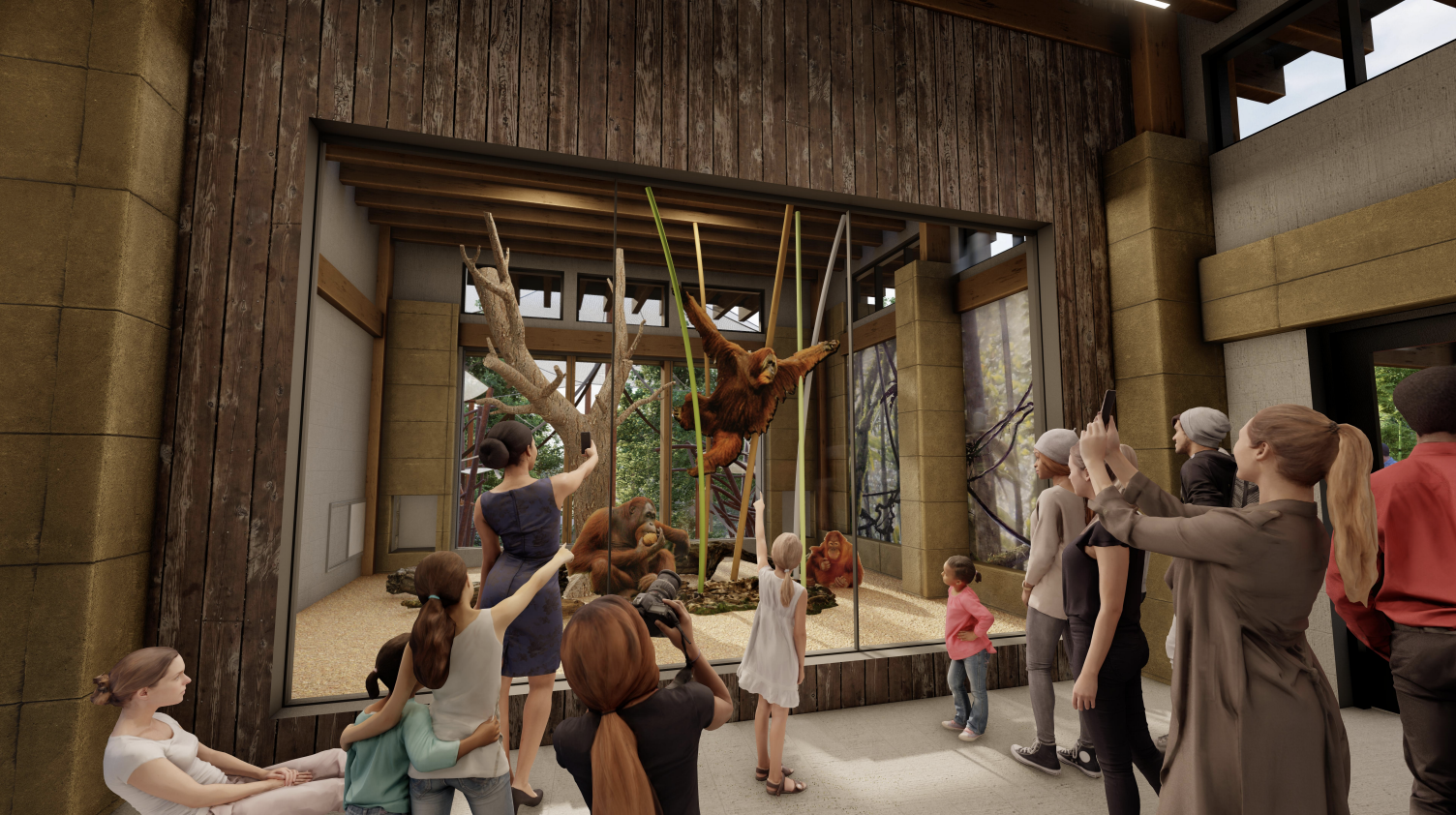 Visitors observing a large indoor exhibit with orangutans, a tree, and ropes inside a zoo or wildlife park.