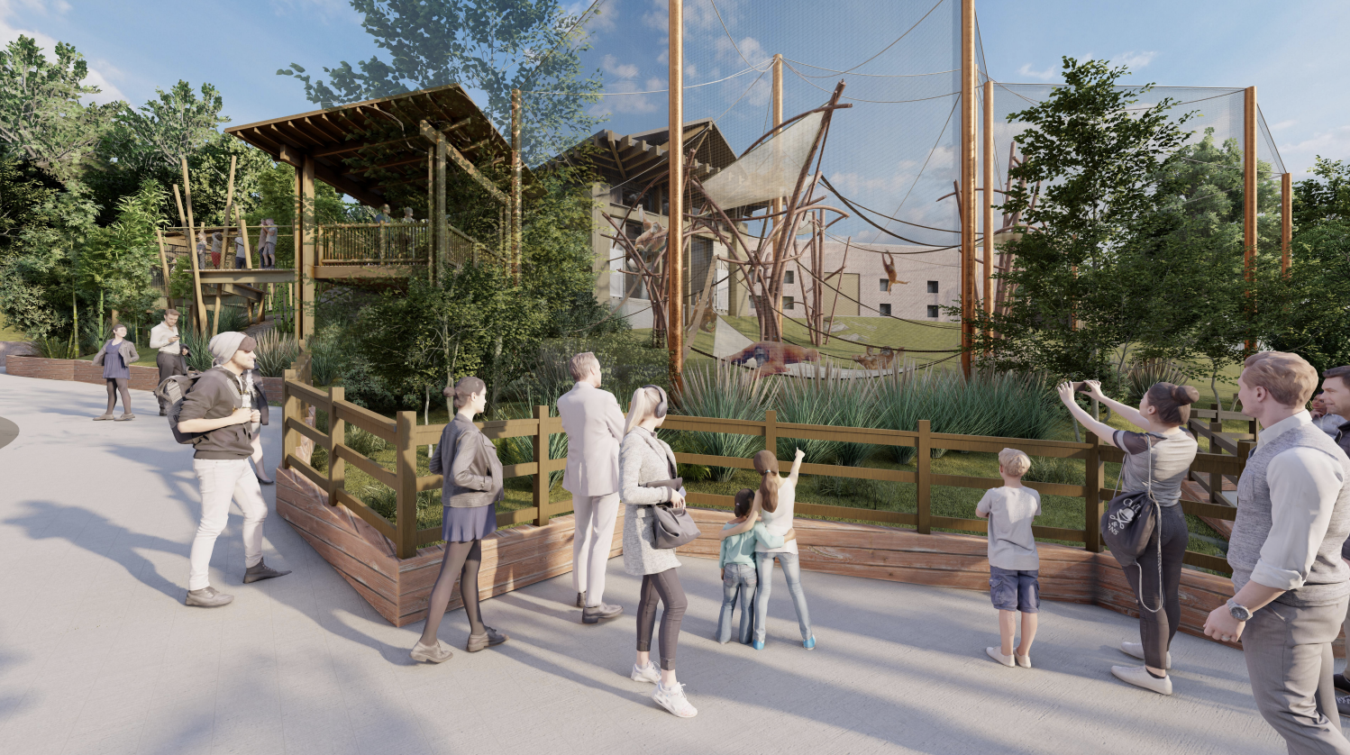 People observing animals at a zoo enclosure with trees, fencing, and a safari-themed habitat with hanging ropes and animals.