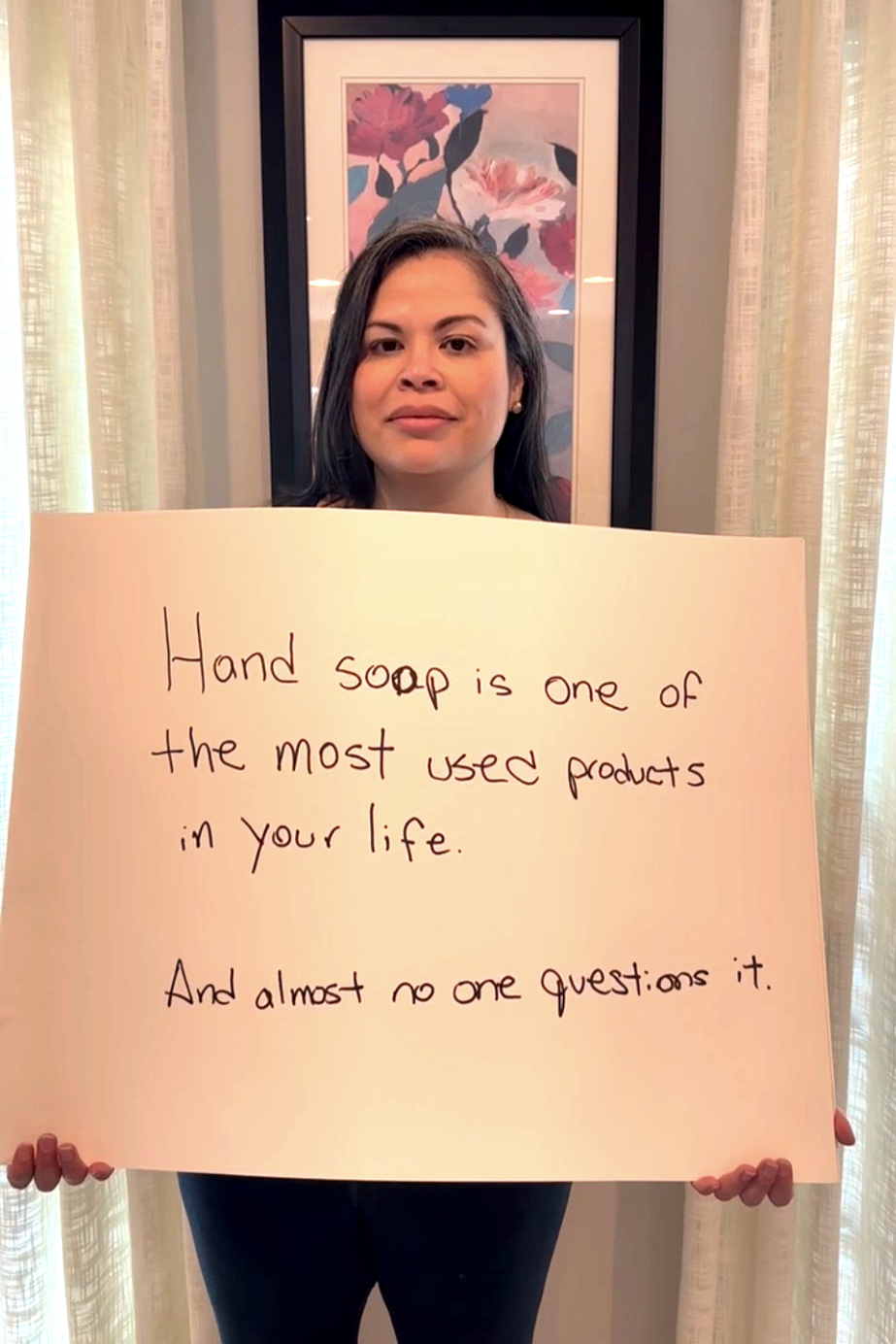 woman holding posterboard