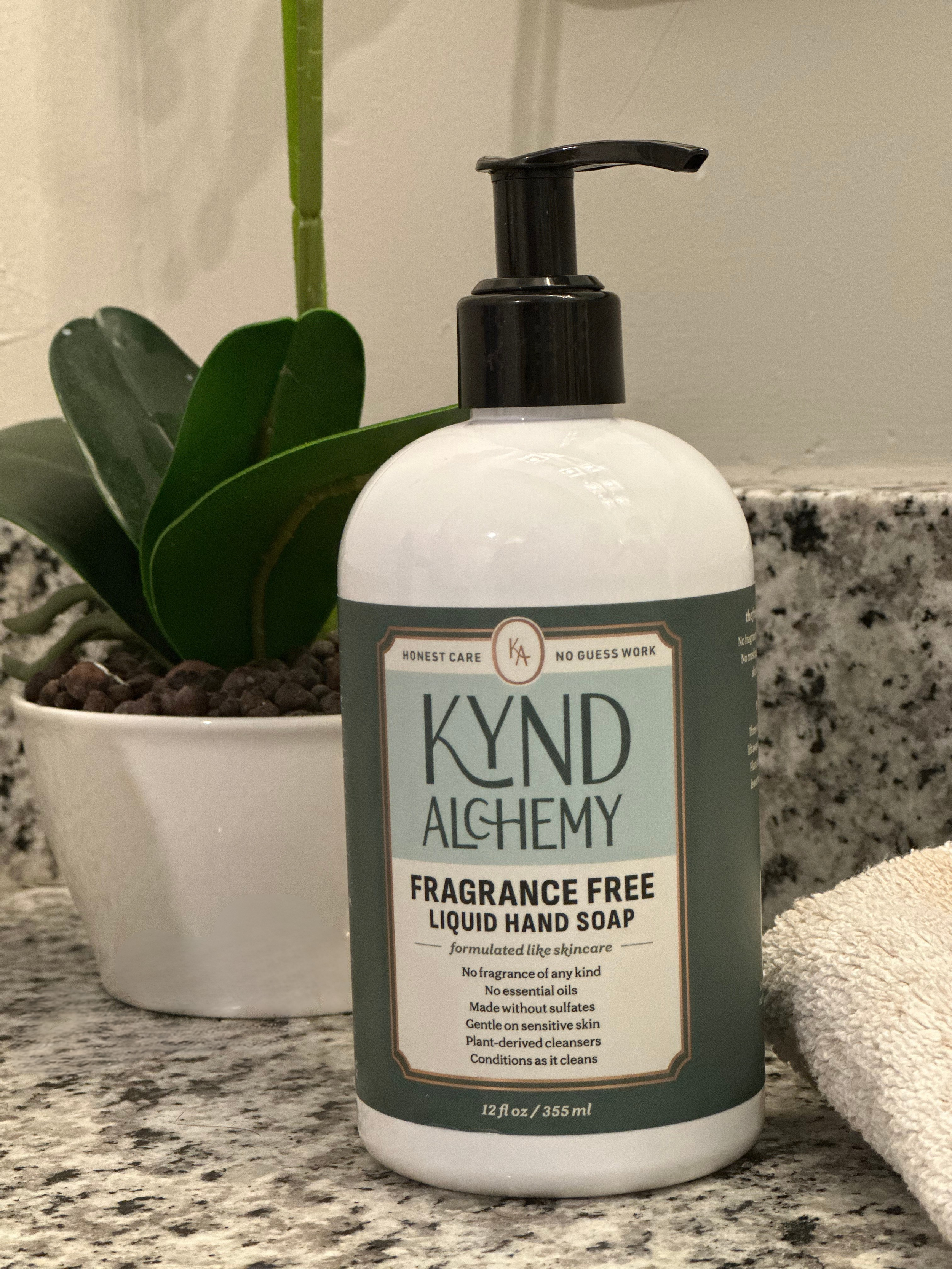 Kynd Alchemy 12 oz fragrance-free hand soap bottle on a bathroom counter