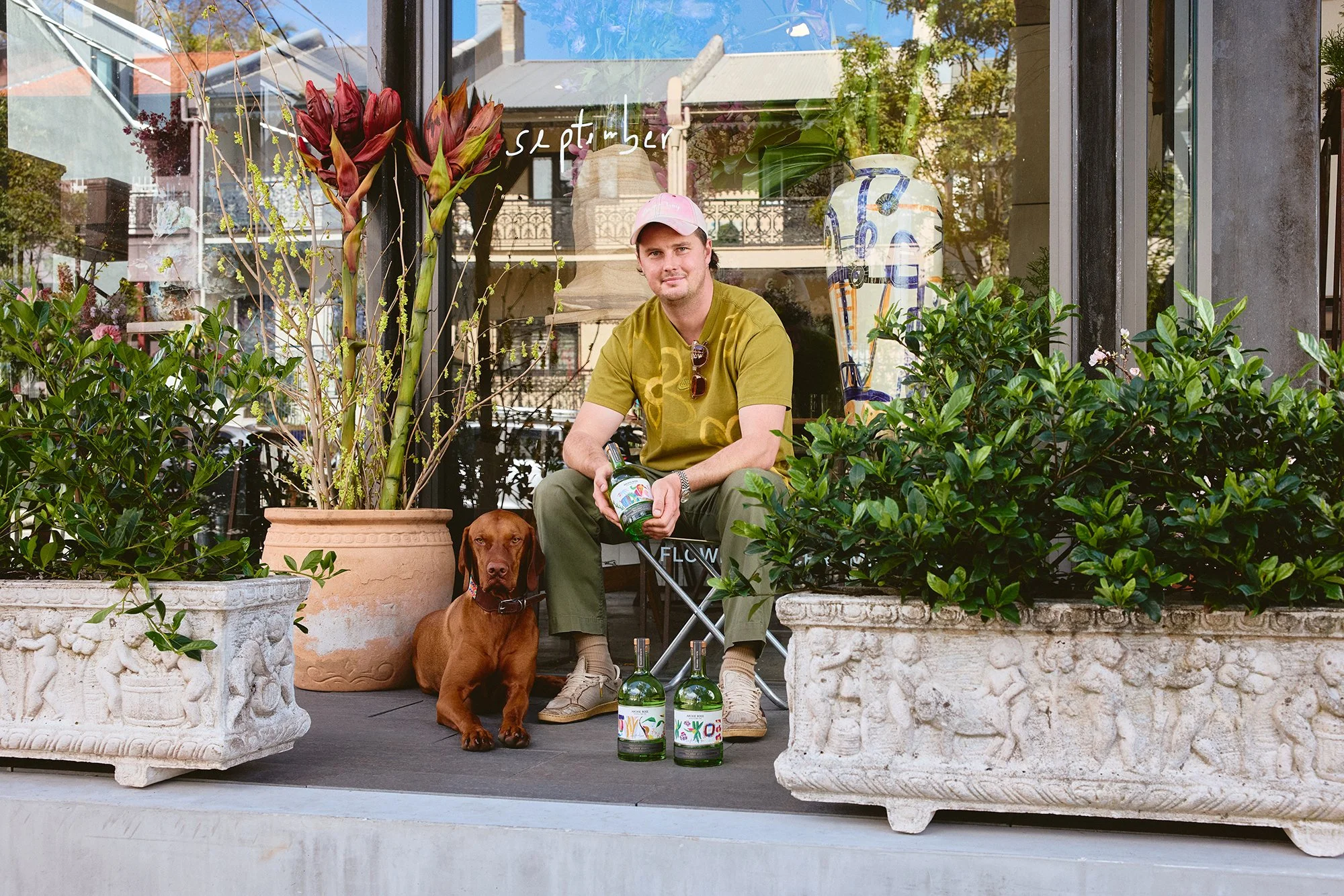 SEPTEMBER-STUDIOS-GIN-ARCHIE-ROSE-CREATOR-SERIES-BRYCE-WITH-BOTTLES-IN-FRONT-OF-STORE-LO-RES.jpg