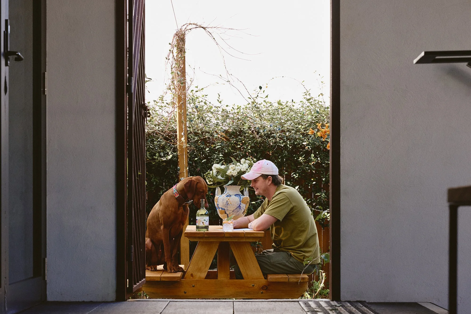 SEPTEMBER-STUDIOS-GIN-ARCHIE-ROSE-CREATOR-SERIES-BRYCE-WITH-DOG-IN-COURTYARD-2-LO-RES.jpg