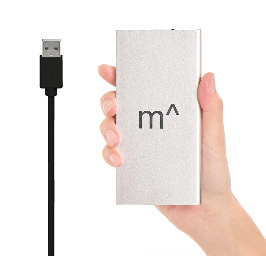 A hand holding a silver rectangular portable power bank with a logo, next to a black USB cable with a Type-A connector.