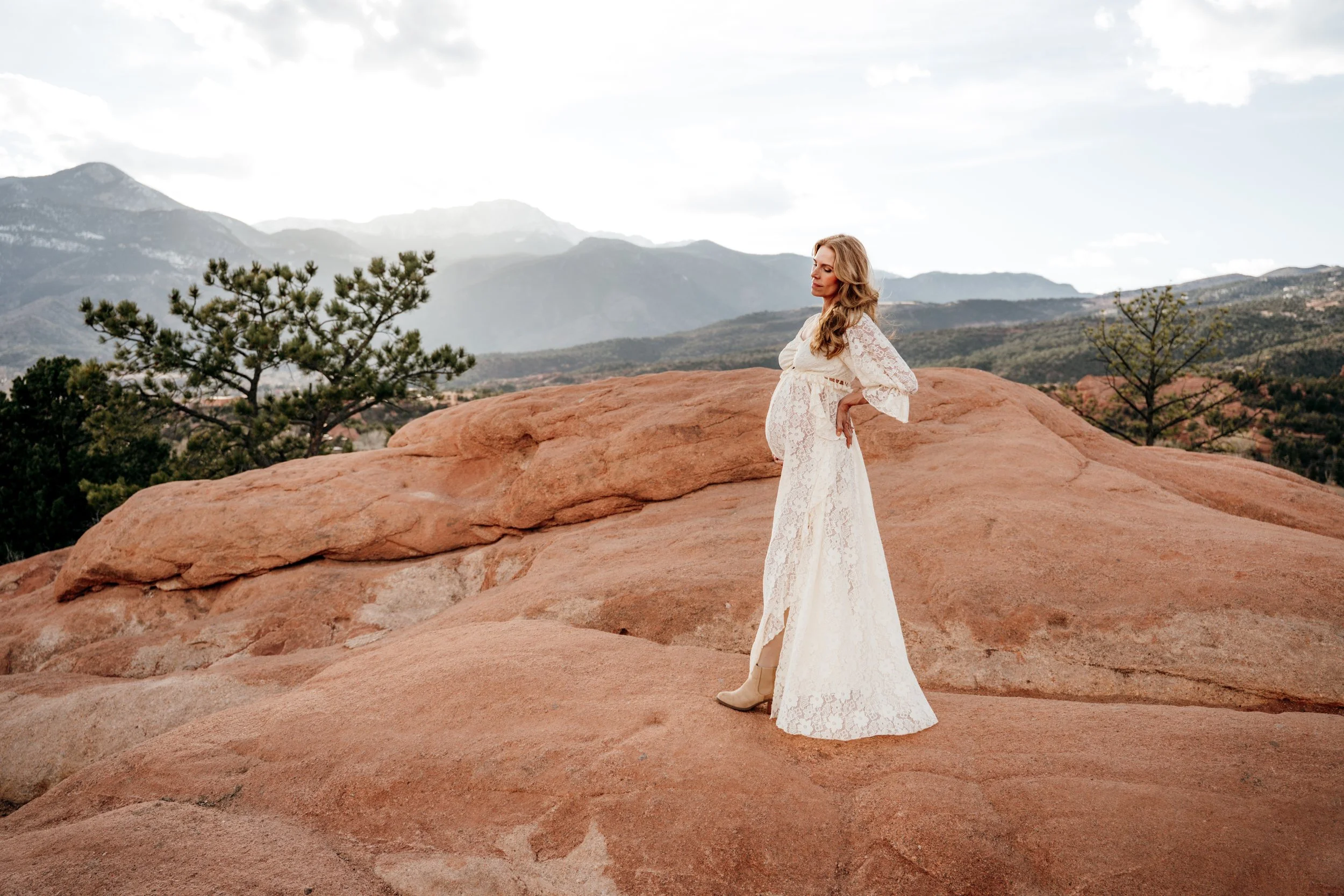 Lifestyle maternity photography session at Garden of the Gods in Colorado Springs featuring an expectant mother enjoying the mountain scenery.