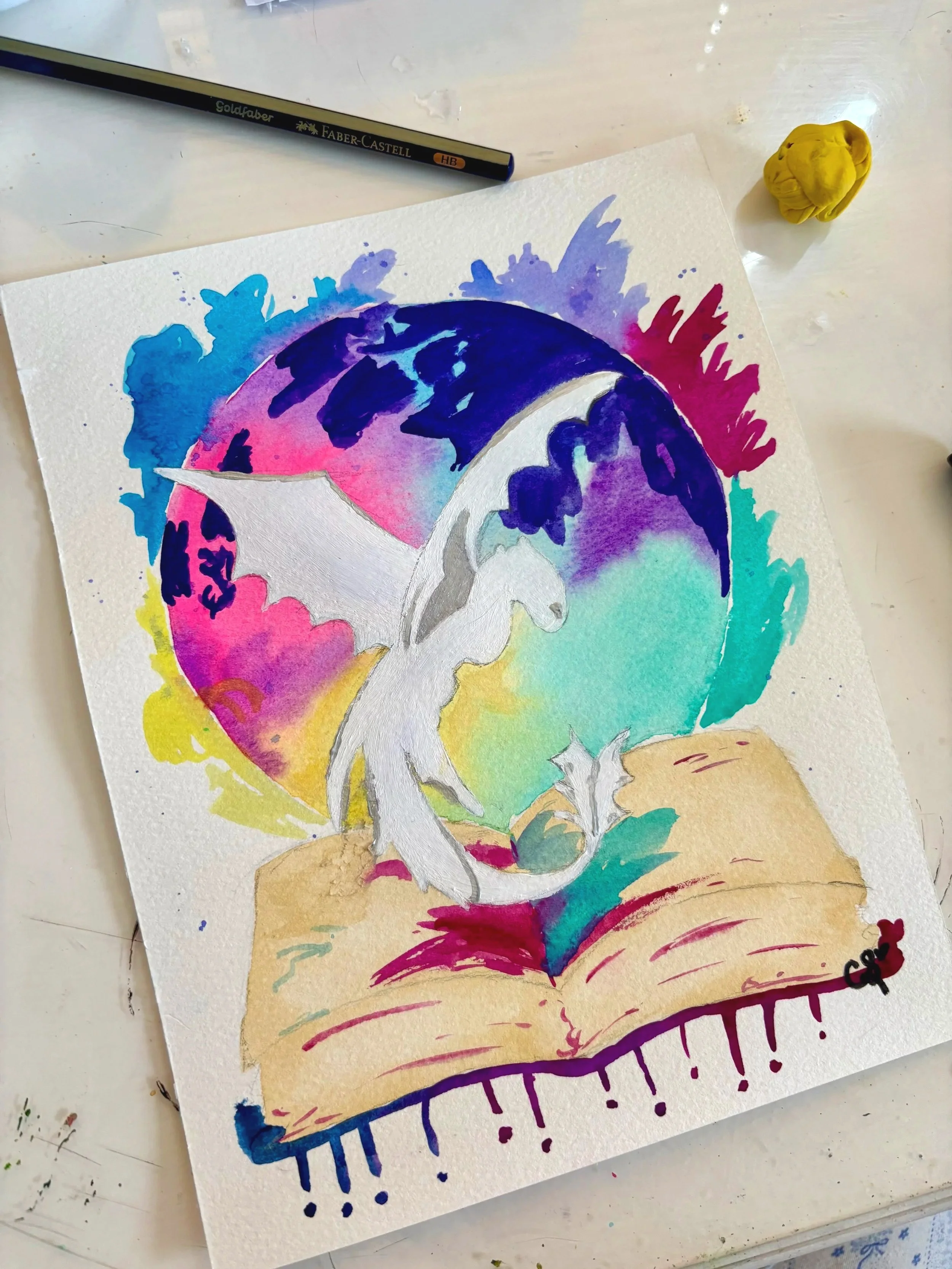 Watercolor painting of a white dragon with outstretched wings flying over an open book, with a colorful background including a globe painted in blue, purple, pink, and green hues.