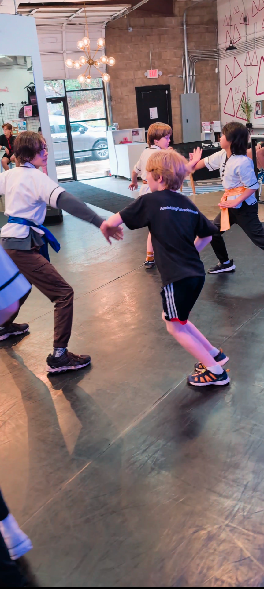 A balanced child practicing Kung-Fu for confidence and focus at Austin Kung-Fu Academy.