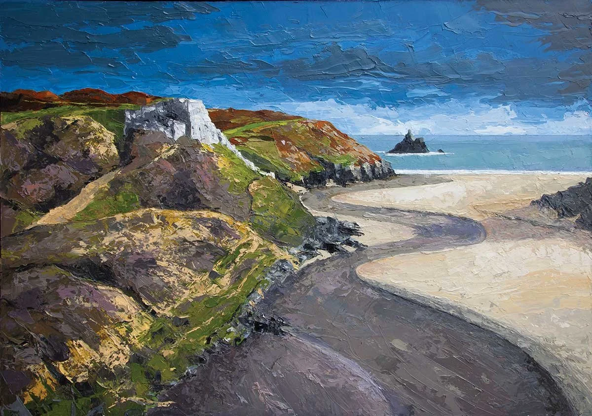 An oil painting of a coastal landscape featuring rocky cliffs with patches of green grass, a sandy beach with a winding dark pathway, and a calm blue sea with a small rocky island in the distance under a cloudy sky in wales.