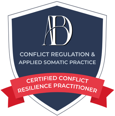 A shield-shaped emblem with a navy blue background and white border. The top features a stylized 'AB' monogram. Below, white text reads 'Conflict Regulation & Applied Somatic Practice.' A red ribbon across the lower part of the shield states 'Certified Conflict Resilience Practitioner' in white text.