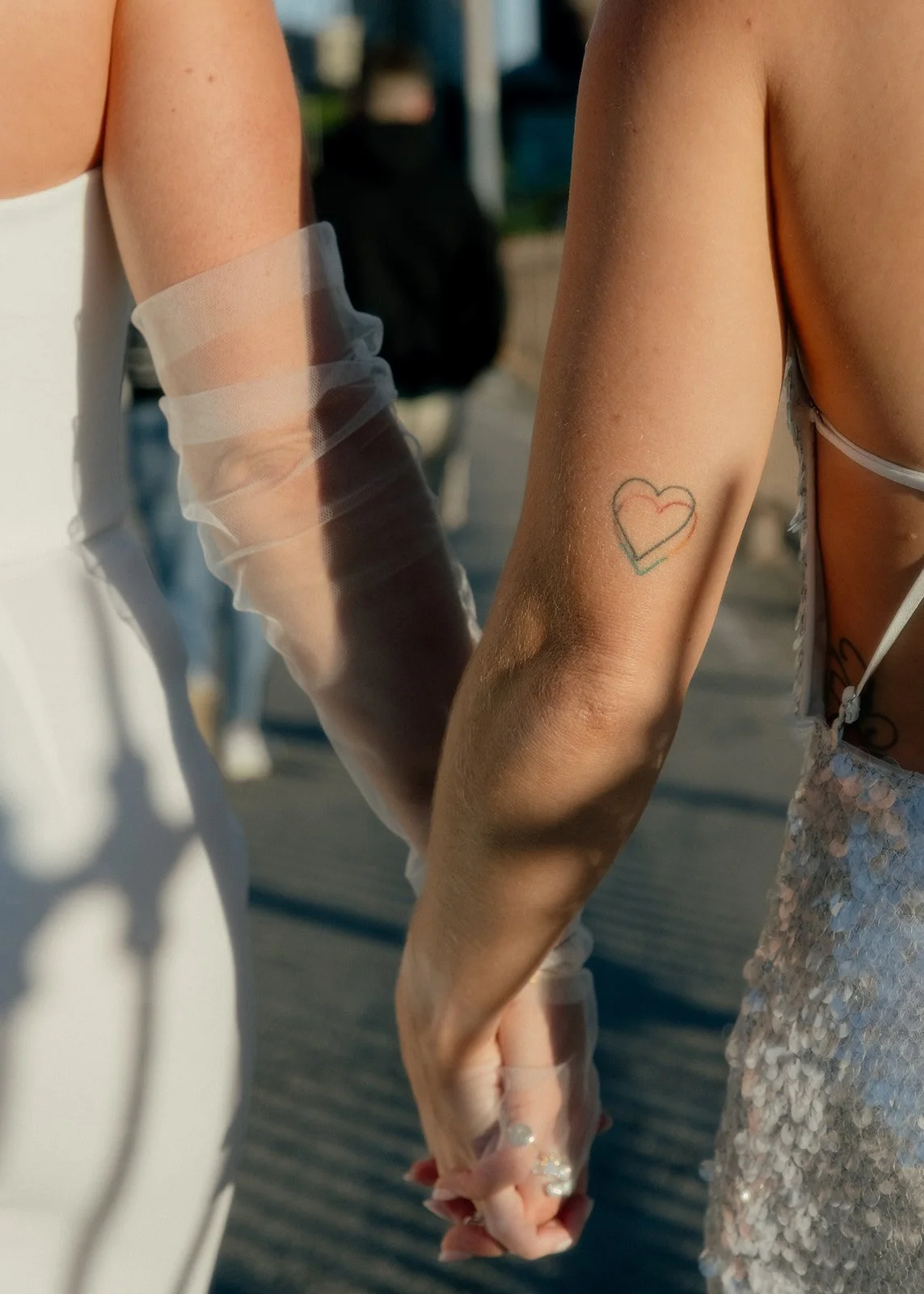 Two brides walking through NYC, LGBTQ wedding photographer